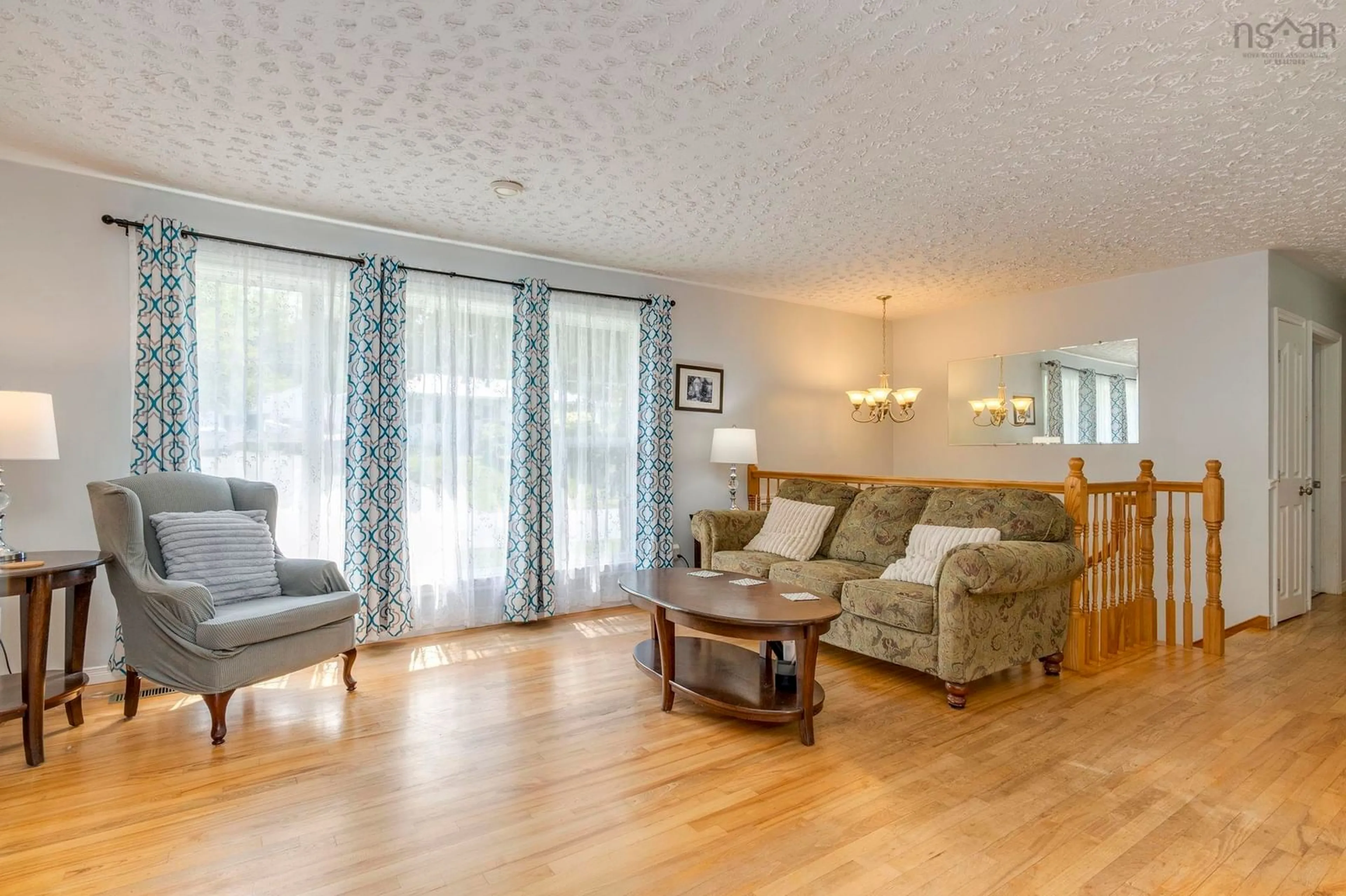 Living room with furniture, wood/laminate floor for 75 Shea St, Lower Sackville Nova Scotia B4C 2B2