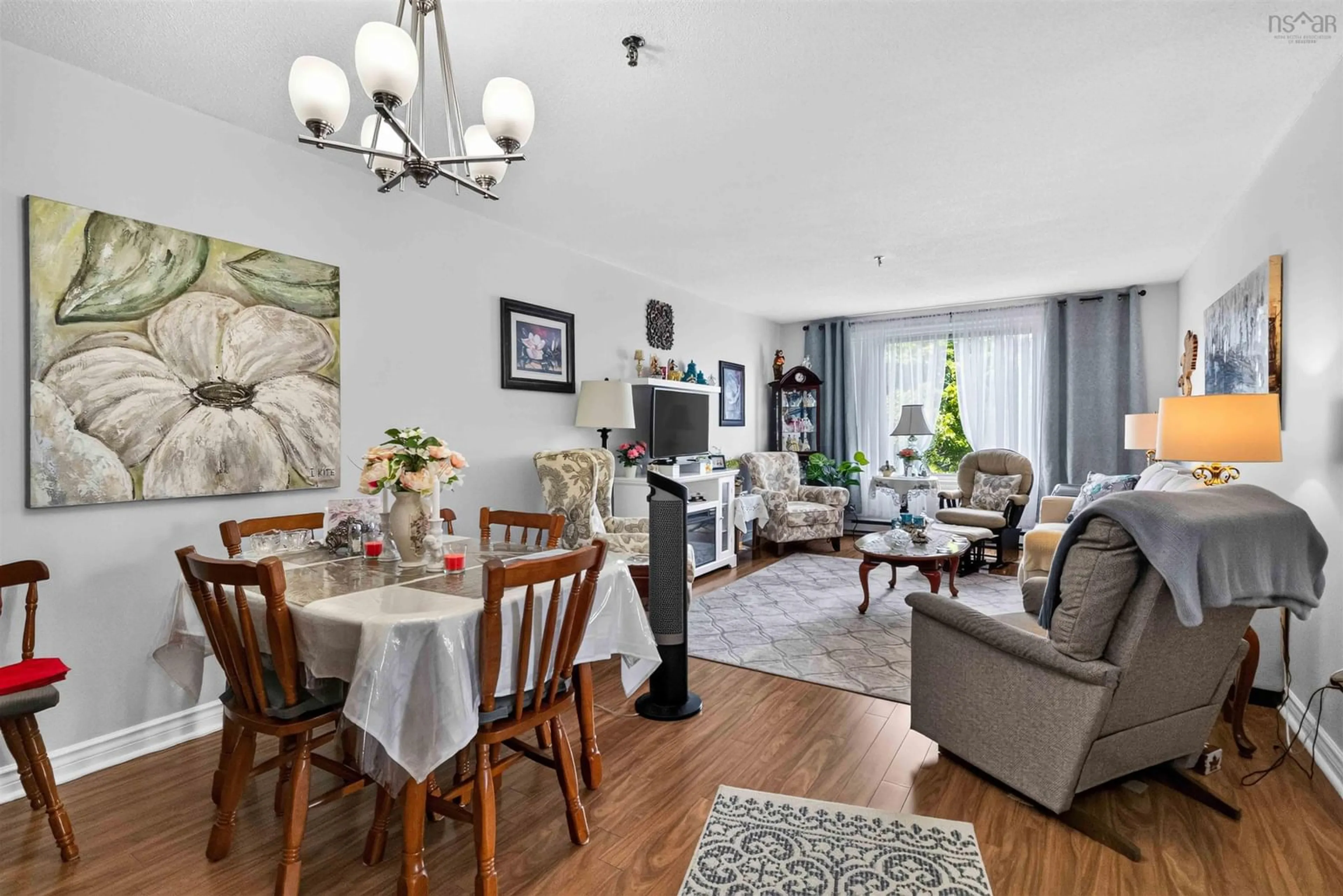 Living room with furniture, wood/laminate floor for 64 Cumberland Dr #310, Cole Harbour Nova Scotia B2V 2C7