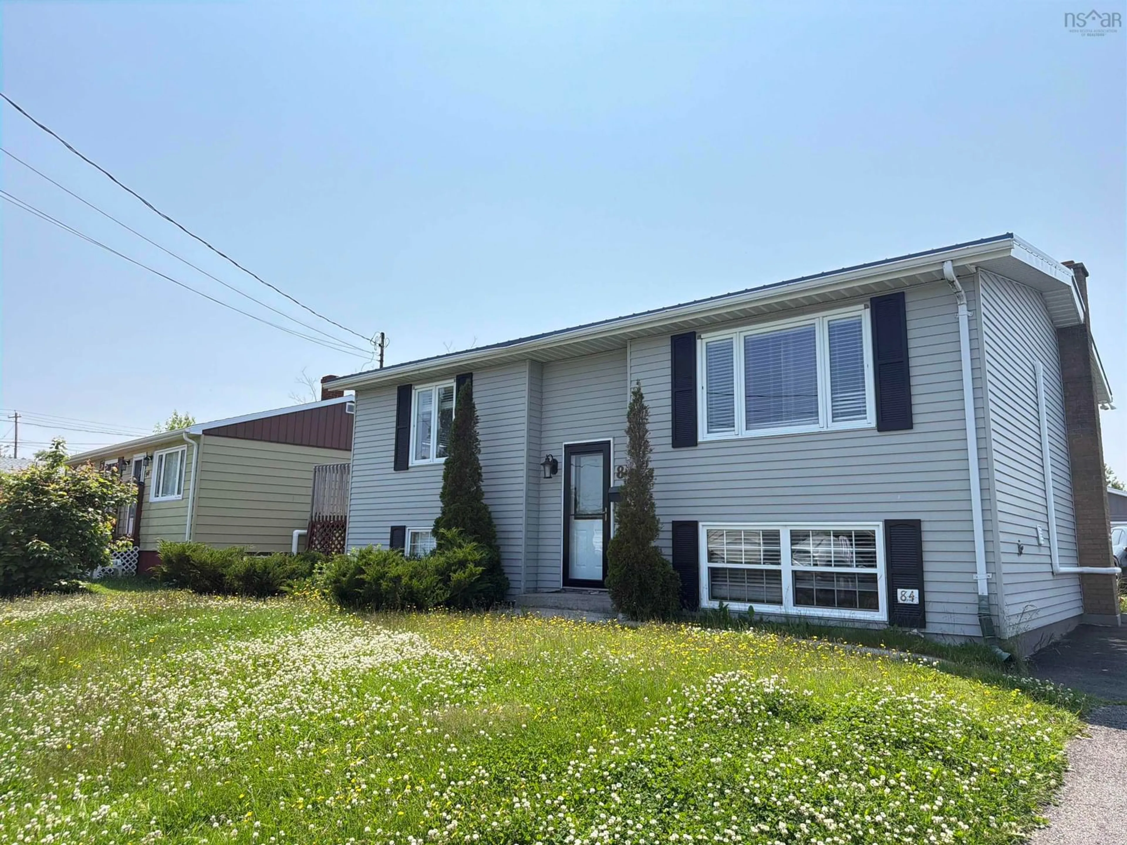 Home with vinyl exterior material, street for 84 Tillock Dr, Sydney Nova Scotia B1P 6R1