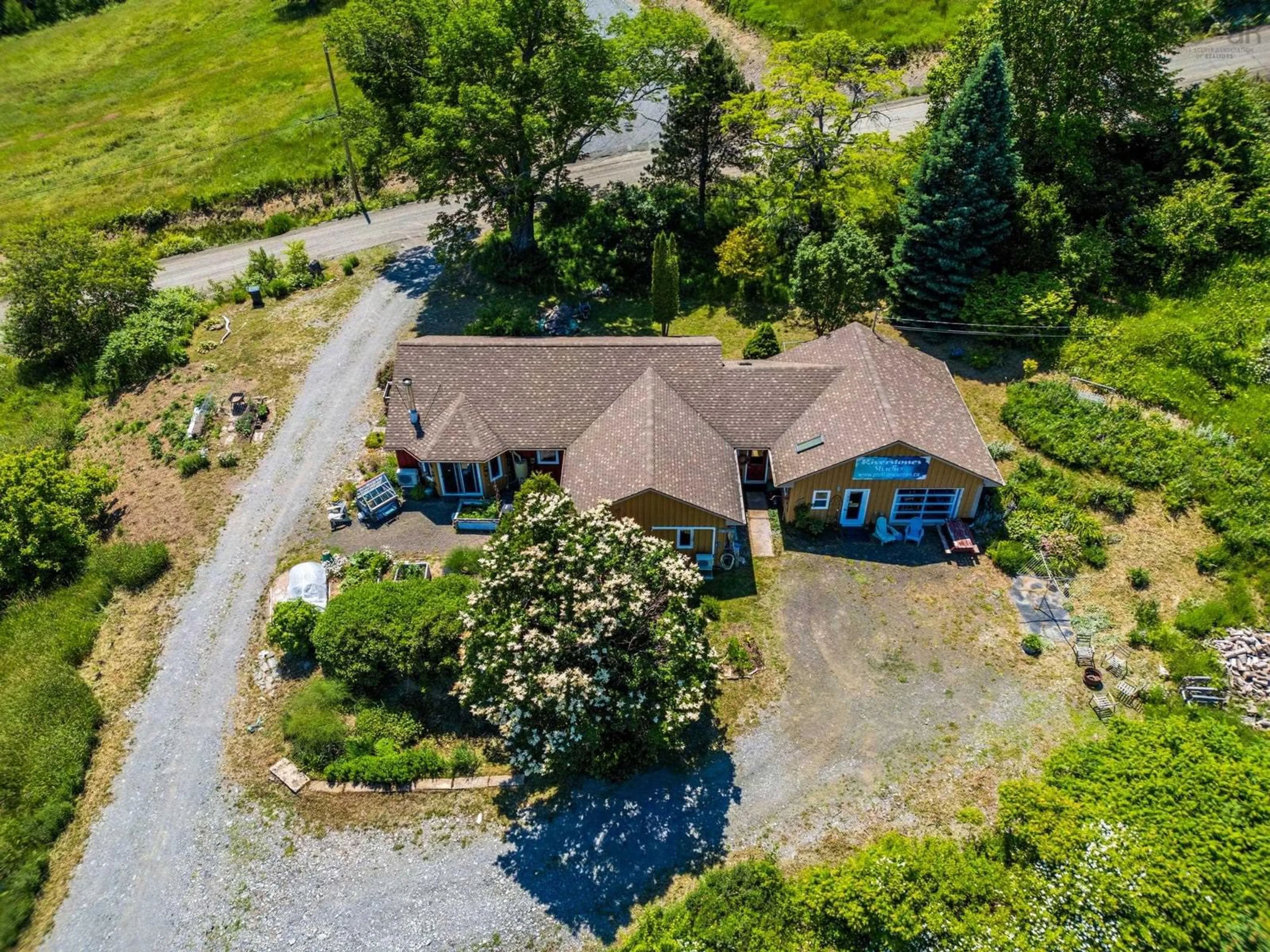 A pic from outside/outdoor area/front of a property/back of a property/a pic from drone, water/lake/river/ocean view for 541 Riverview Road, Bear River Nova Scotia B0S 1B0