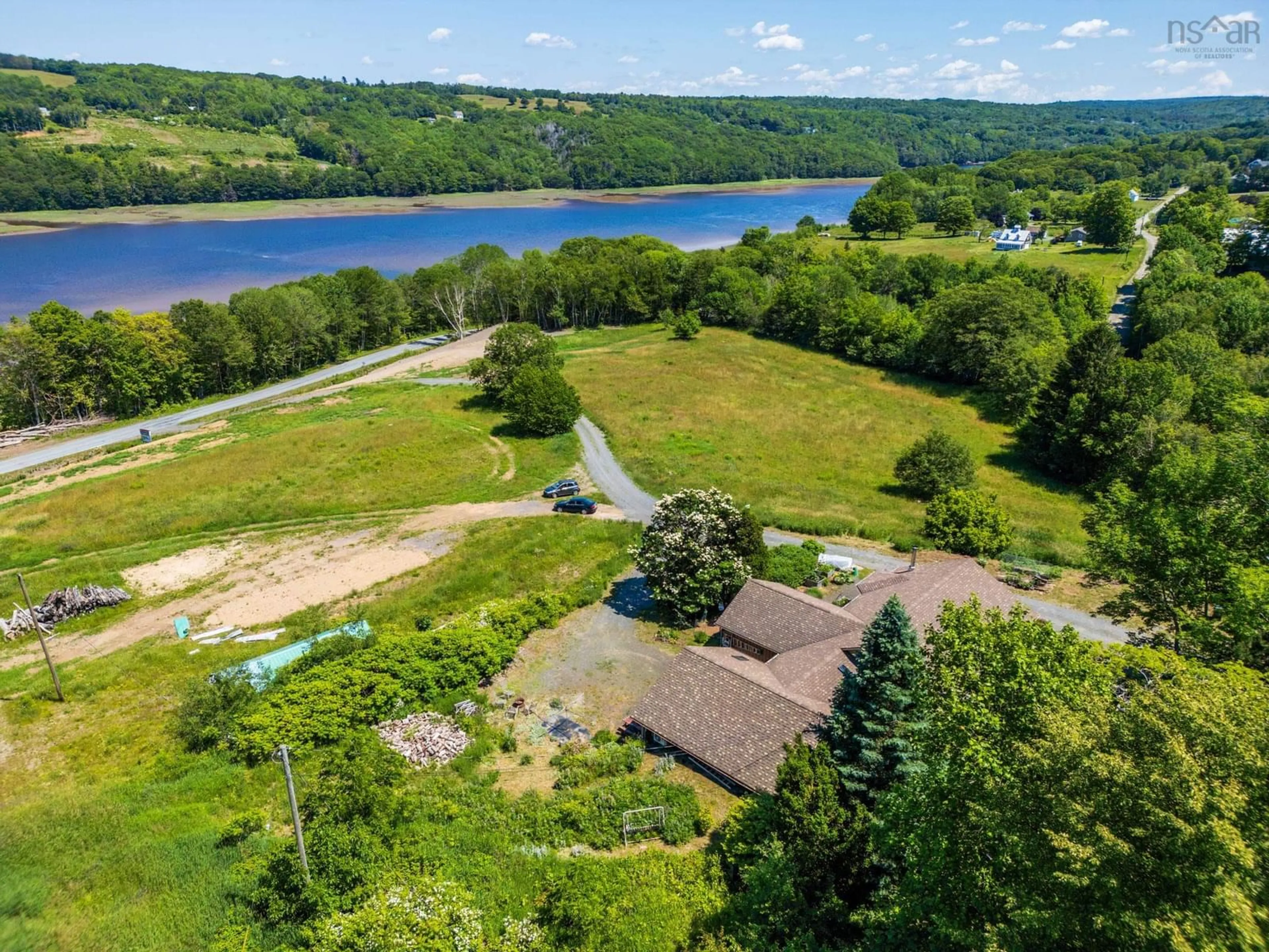 A pic from outside/outdoor area/front of a property/back of a property/a pic from drone, water/lake/river/ocean view for 541 Riverview Road, Bear River Nova Scotia B0S 1B0