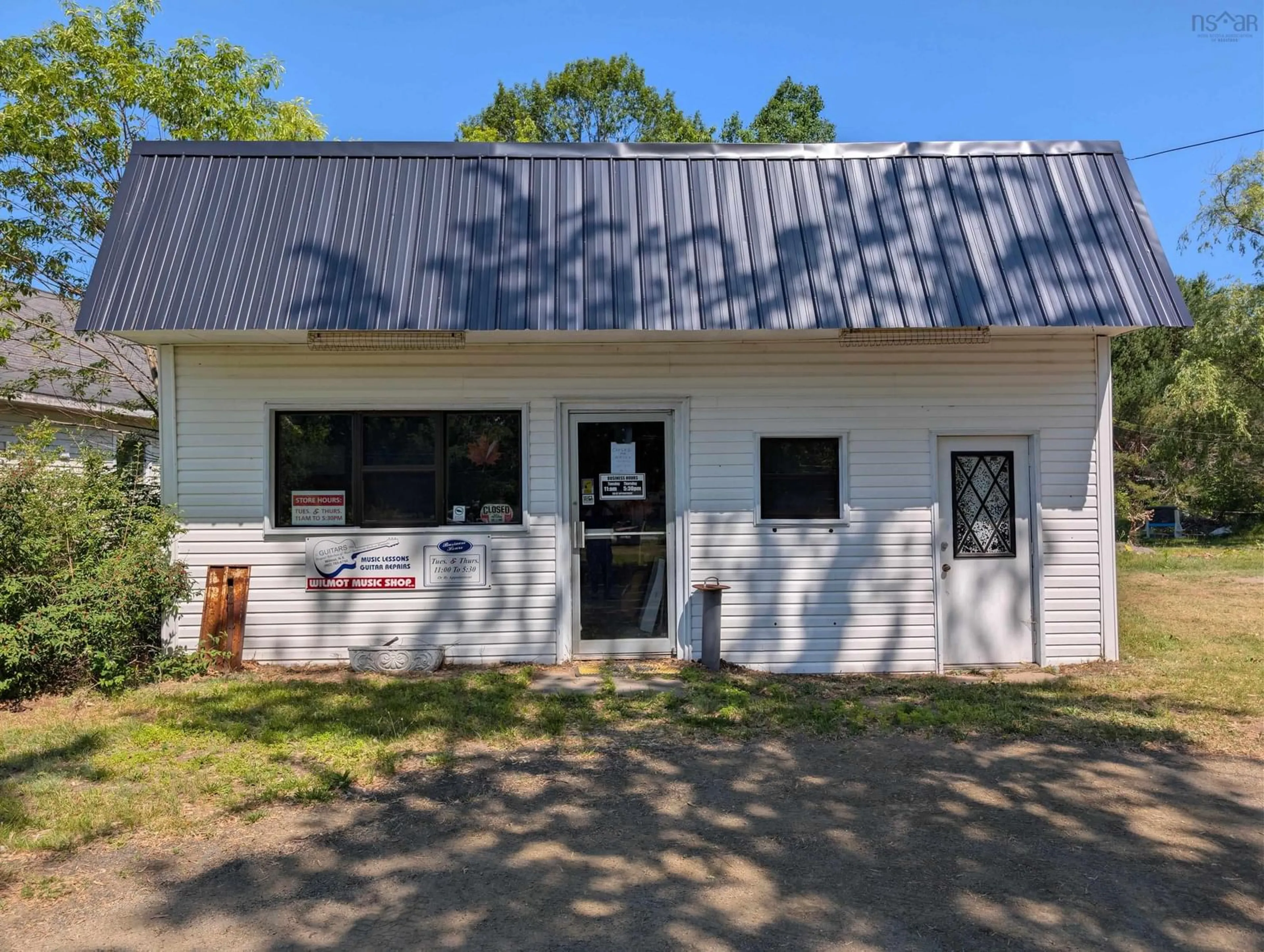 A pic from outside/outdoor area/front of a property/back of a property/a pic from drone, building for 14525 Highway 1, Wilmot Nova Scotia B0P 1W0