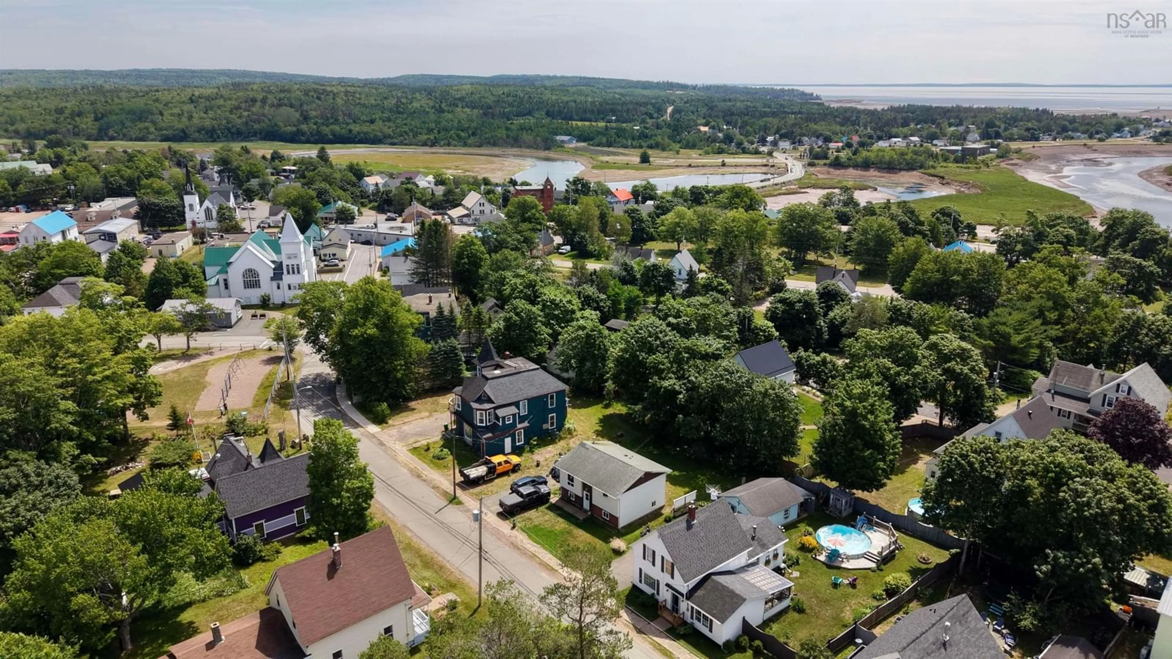 A pic from outside/outdoor area/front of a property/back of a property/a pic from drone, water/lake/river/ocean view for 122 Queen St, Parrsboro Nova Scotia B0M 1S0