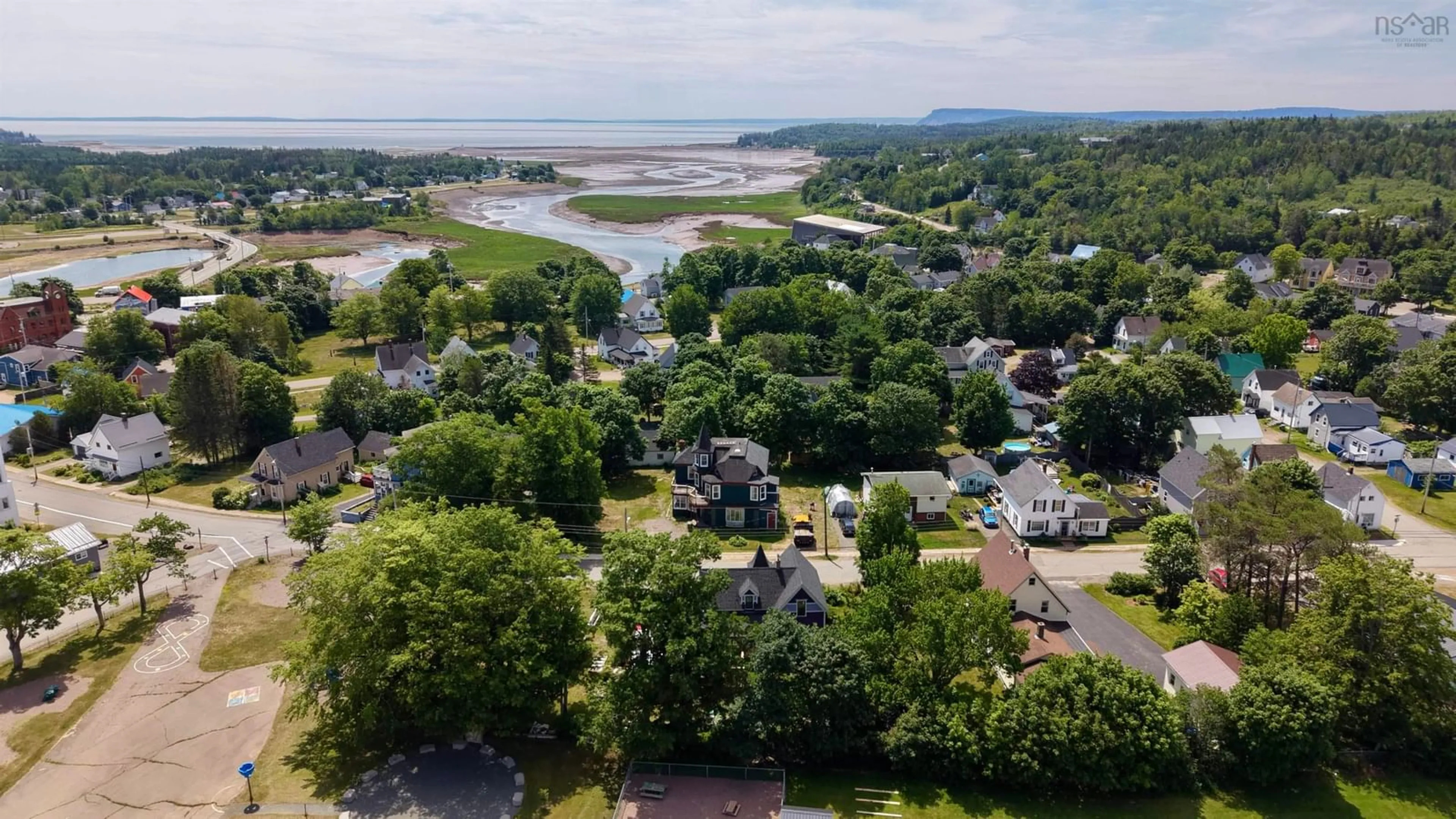A pic from outside/outdoor area/front of a property/back of a property/a pic from drone, water/lake/river/ocean view for 122 Queen St, Parrsboro Nova Scotia B0M 1S0