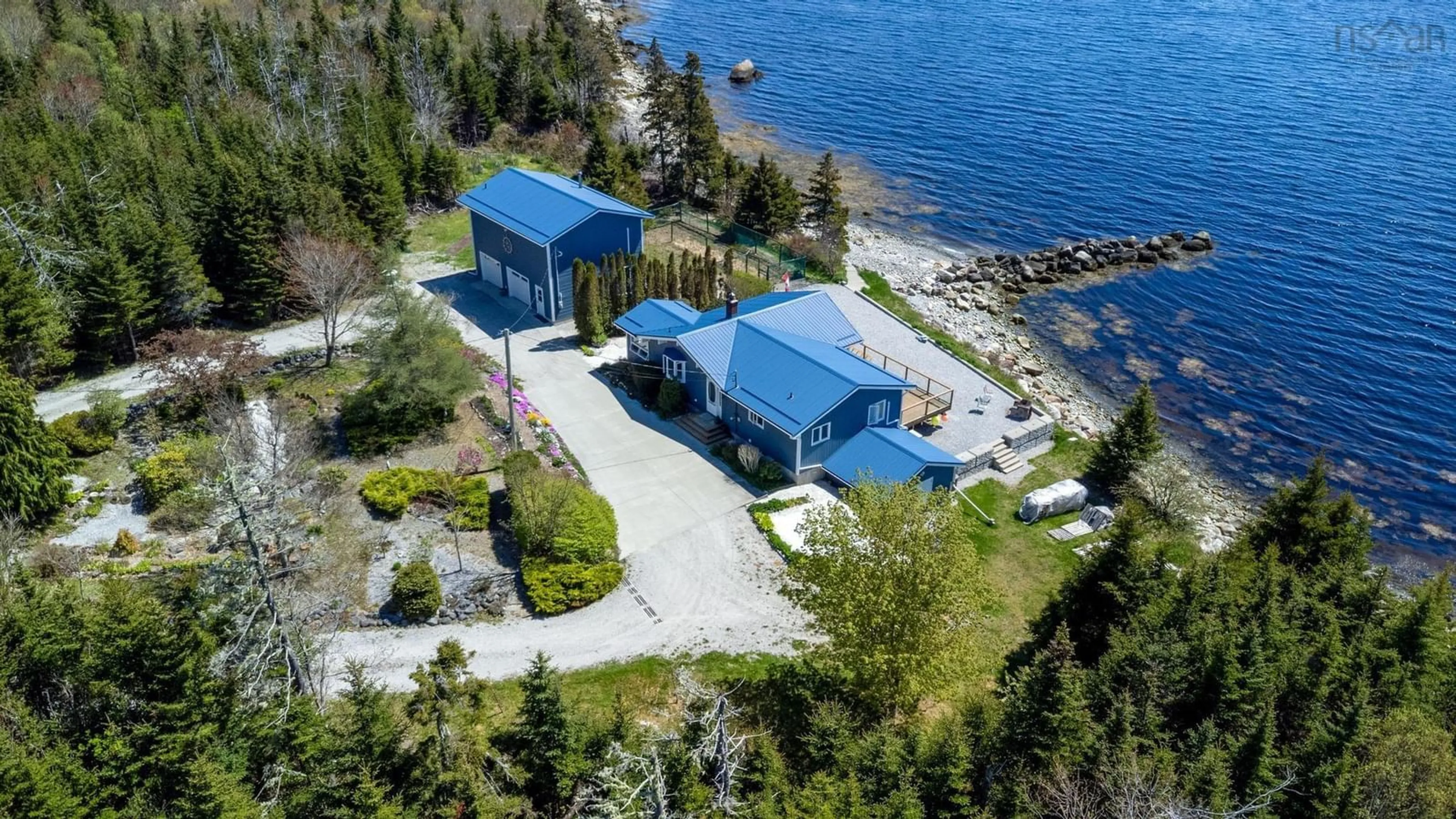 A pic from outside/outdoor area/front of a property/back of a property/a pic from drone, water/lake/river/ocean view for 1904 Sandy Point Rd, Sandy Point Nova Scotia B0T 1W0