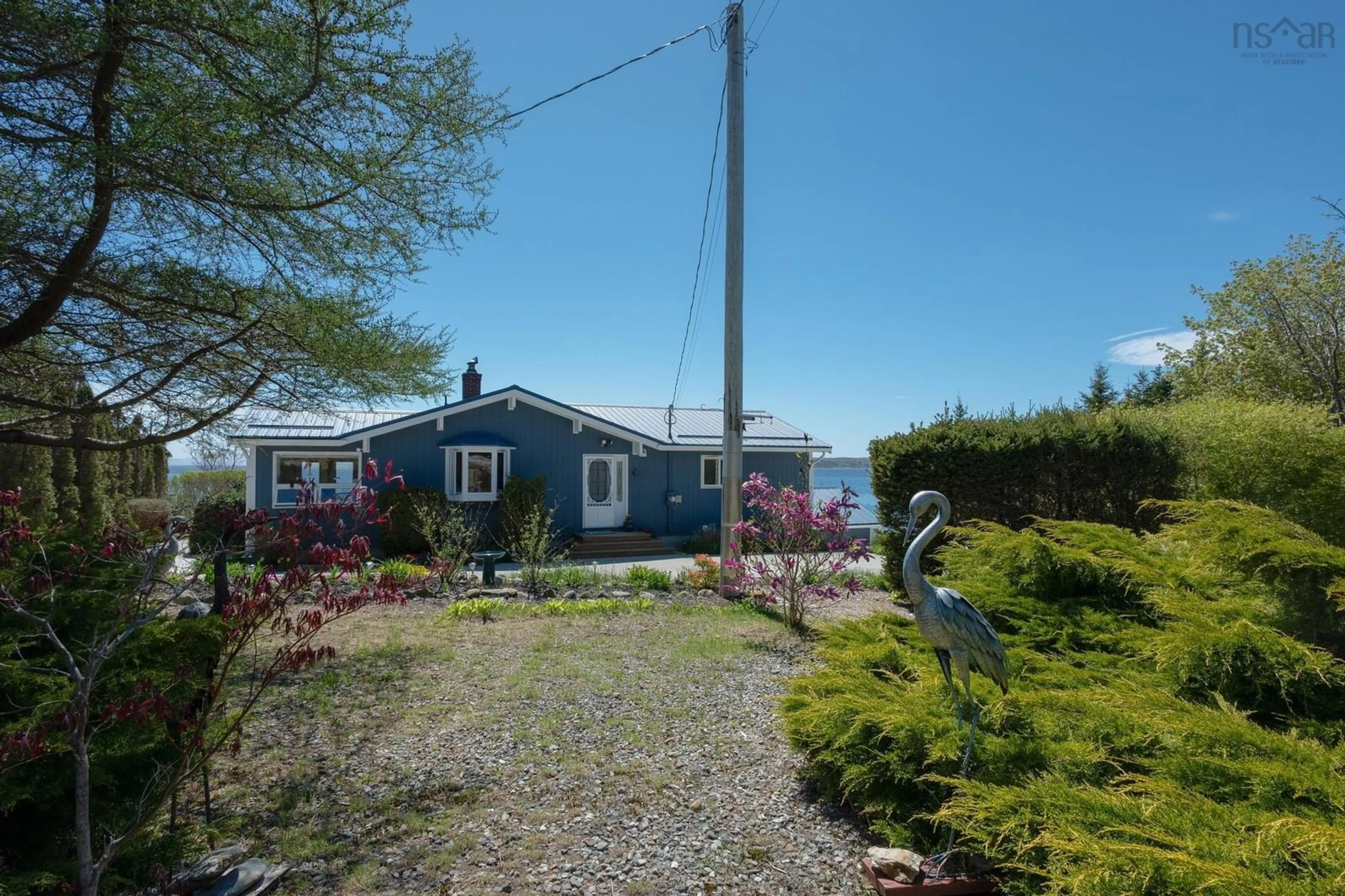A pic from outside/outdoor area/front of a property/back of a property/a pic from drone, water/lake/river/ocean view for 1904 Sandy Point Rd, Sandy Point Nova Scotia B0T 1W0