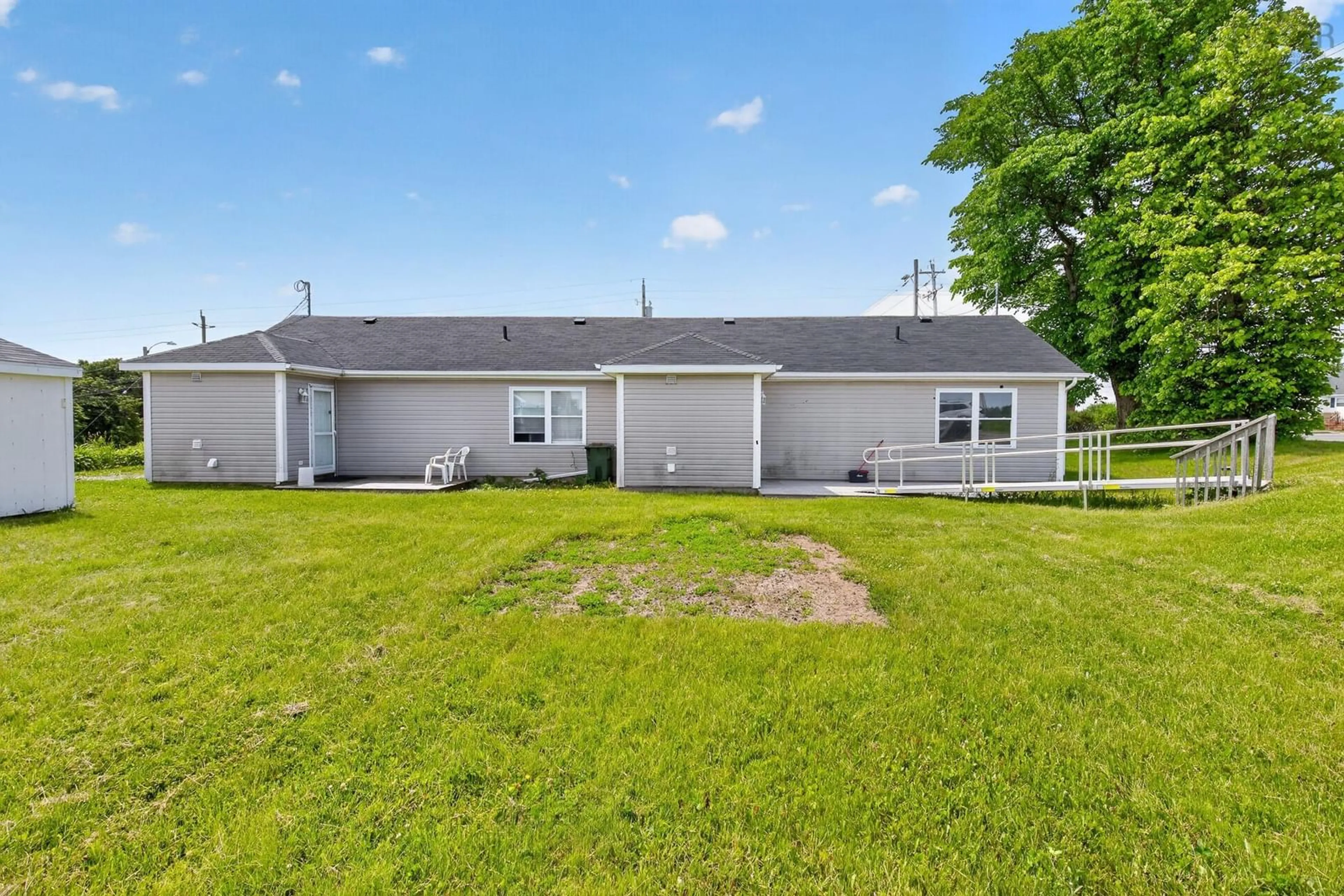 A pic from outside/outdoor area/front of a property/back of a property/a pic from drone, unknown for 942/944 Main St, Glace Bay Nova Scotia B1A 4Z5