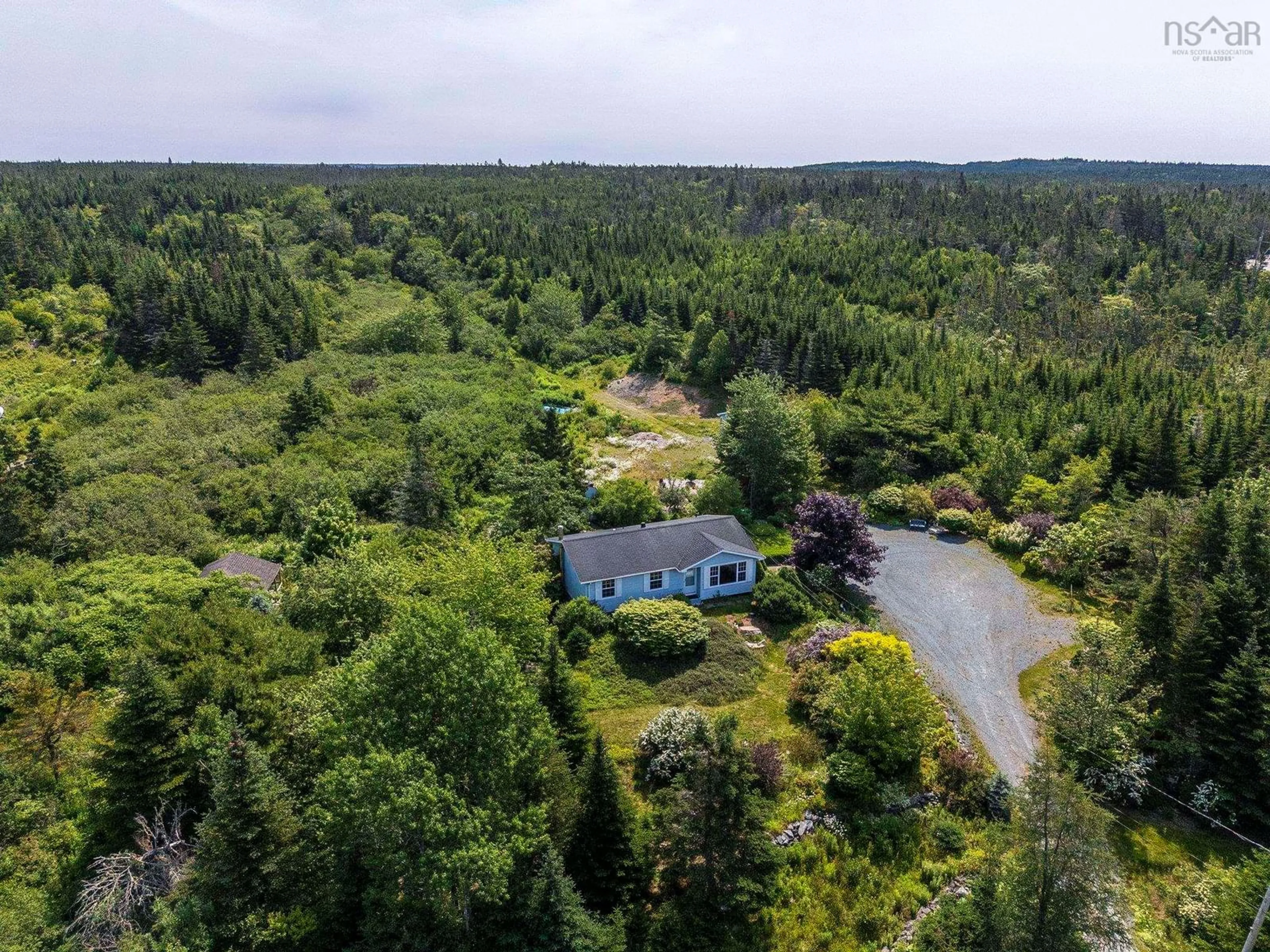 A pic from outside/outdoor area/front of a property/back of a property/a pic from drone, water/lake/river/ocean view for 875 East Chezzetcook Road, Chezzetcook Nova Scotia B0J 2L0