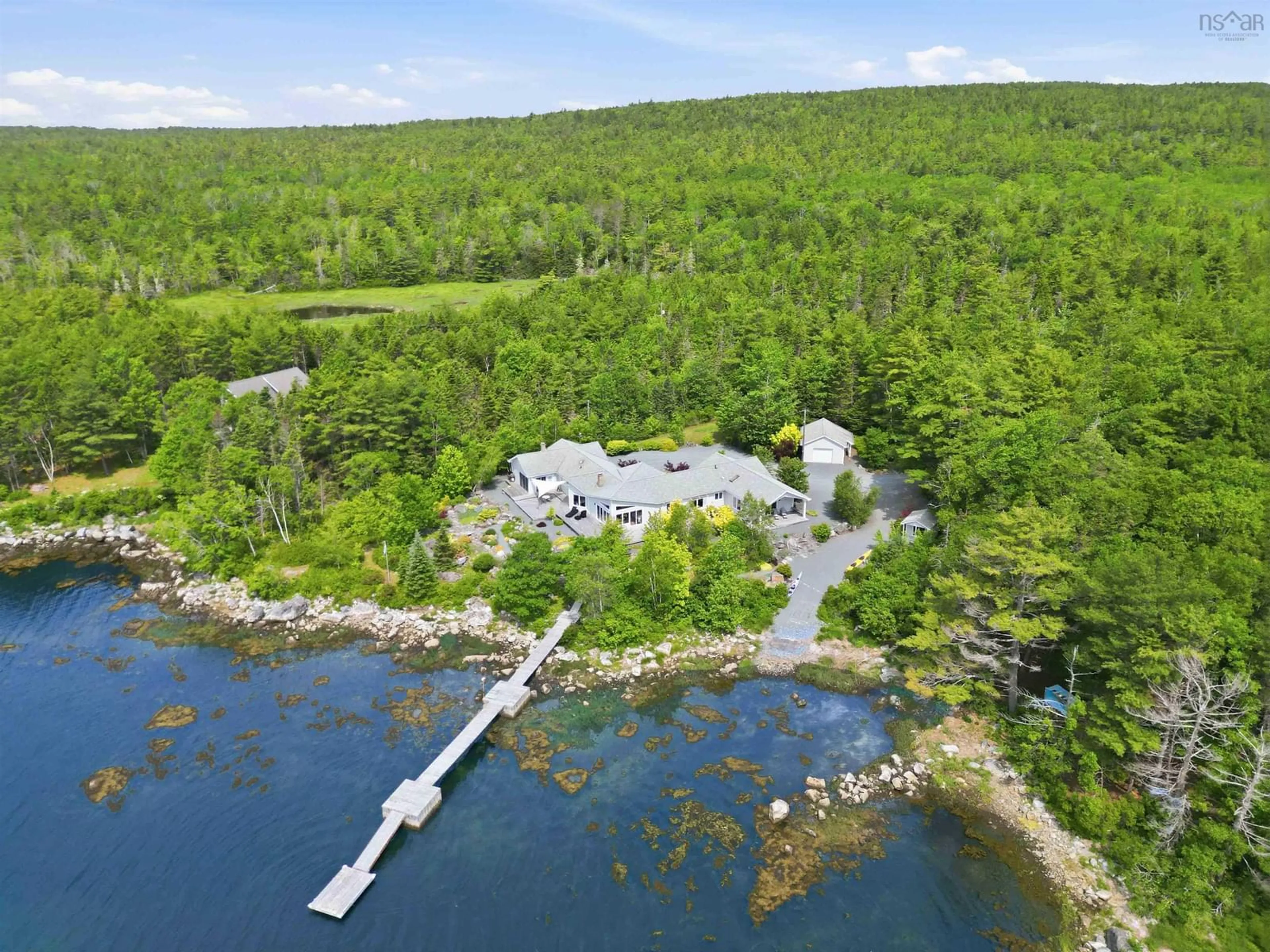 A pic from outside/outdoor area/front of a property/back of a property/a pic from drone, water/lake/river/ocean view for 668 Highway 331, East Port Medway Nova Scotia B0J 2H0