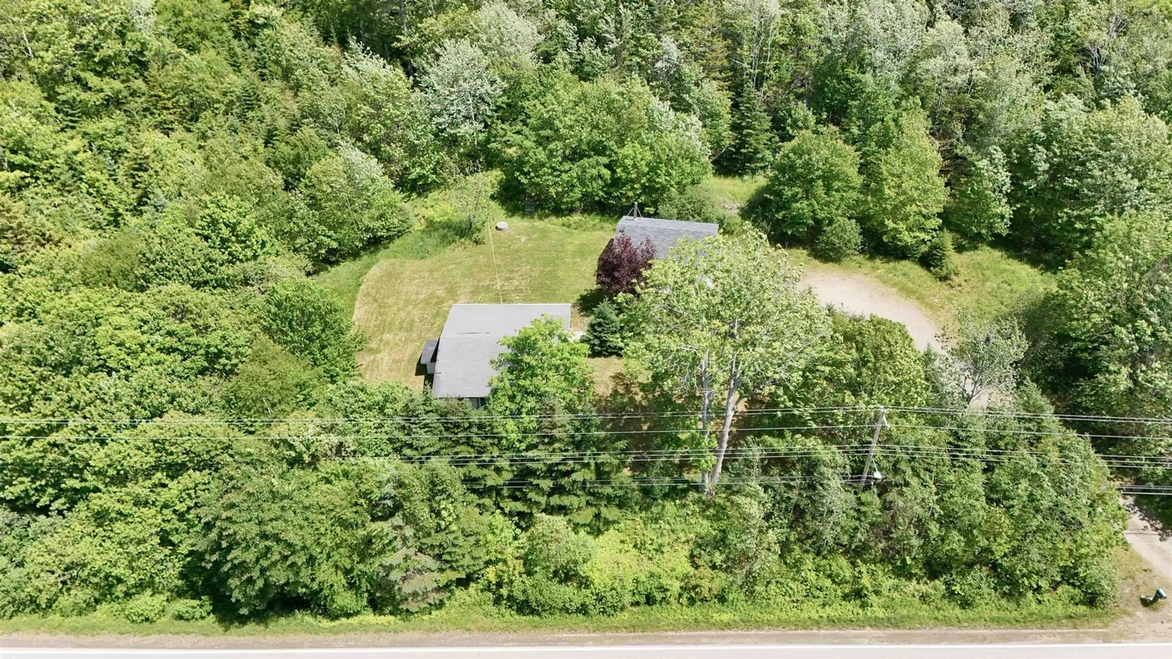 A pic from outside/outdoor area/front of a property/back of a property/a pic from drone, forest/trees view for 3810 Highway 340, Carleton Nova Scotia B5A 5P8