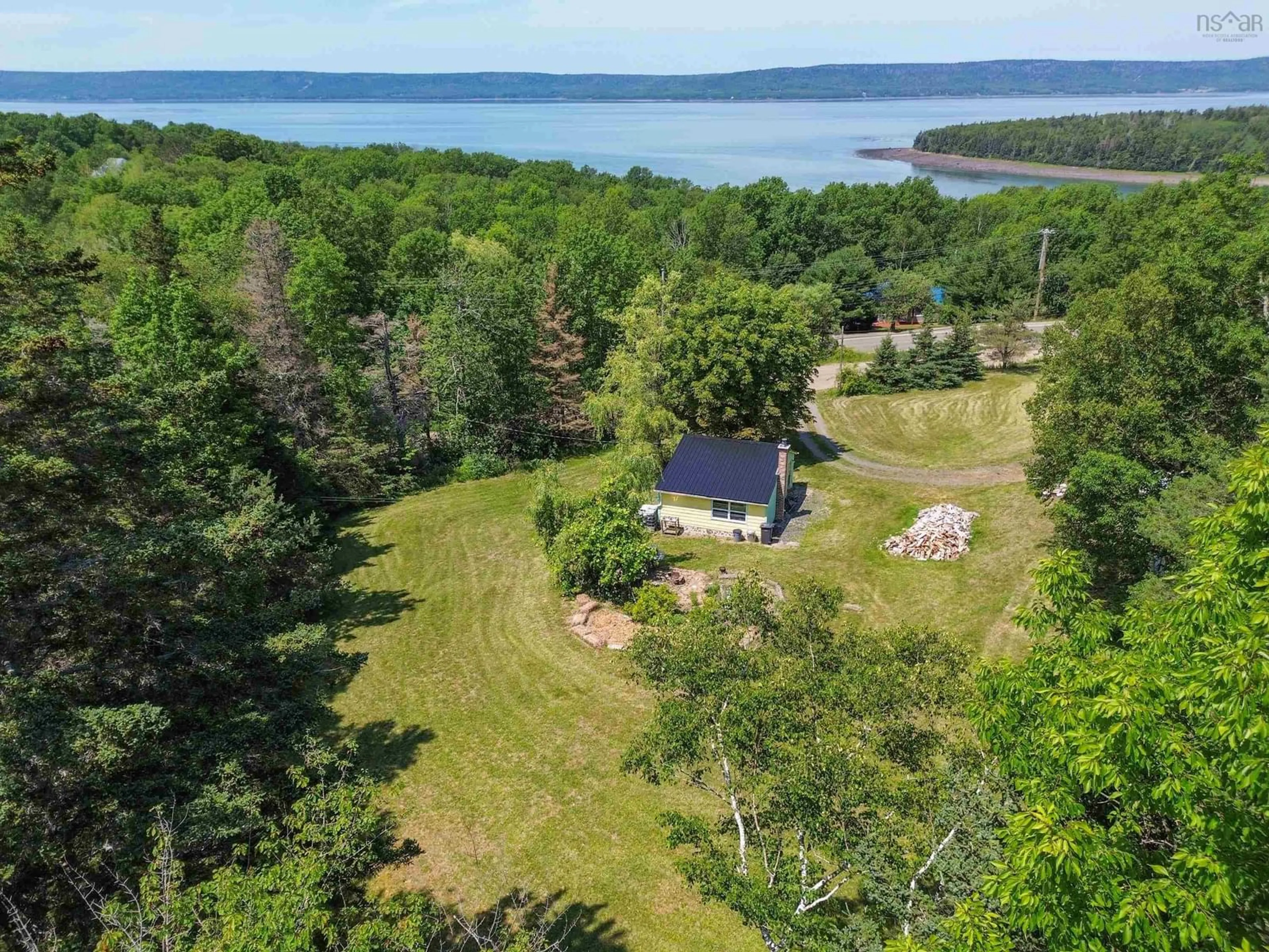 A pic from outside/outdoor area/front of a property/back of a property/a pic from drone, water/lake/river/ocean view for 30 M And R Street, Clementsport Nova Scotia B0S 1A0