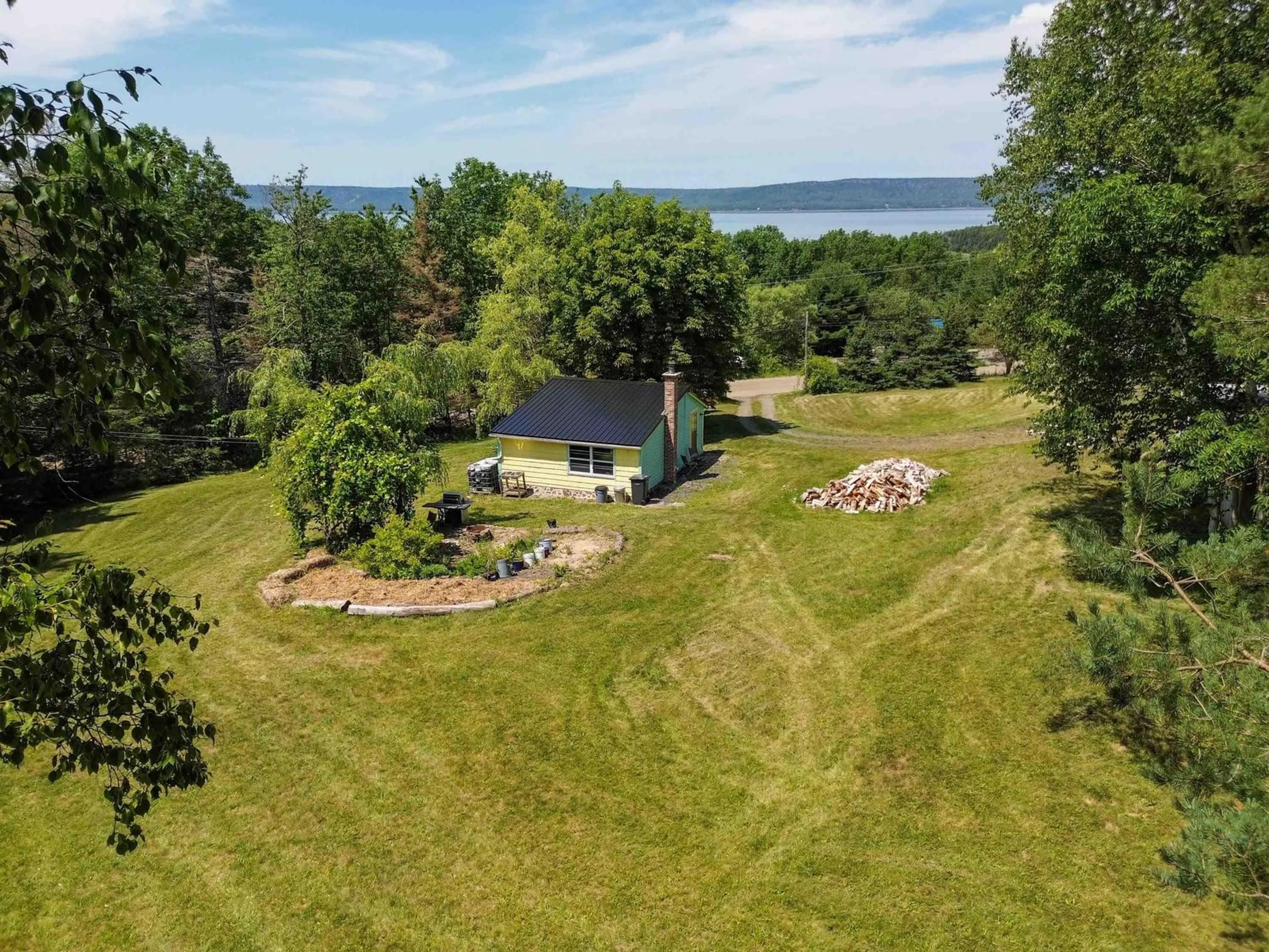 A pic from outside/outdoor area/front of a property/back of a property/a pic from drone, water/lake/river/ocean view for 30 M And R Street, Clementsport Nova Scotia B0S 1A0