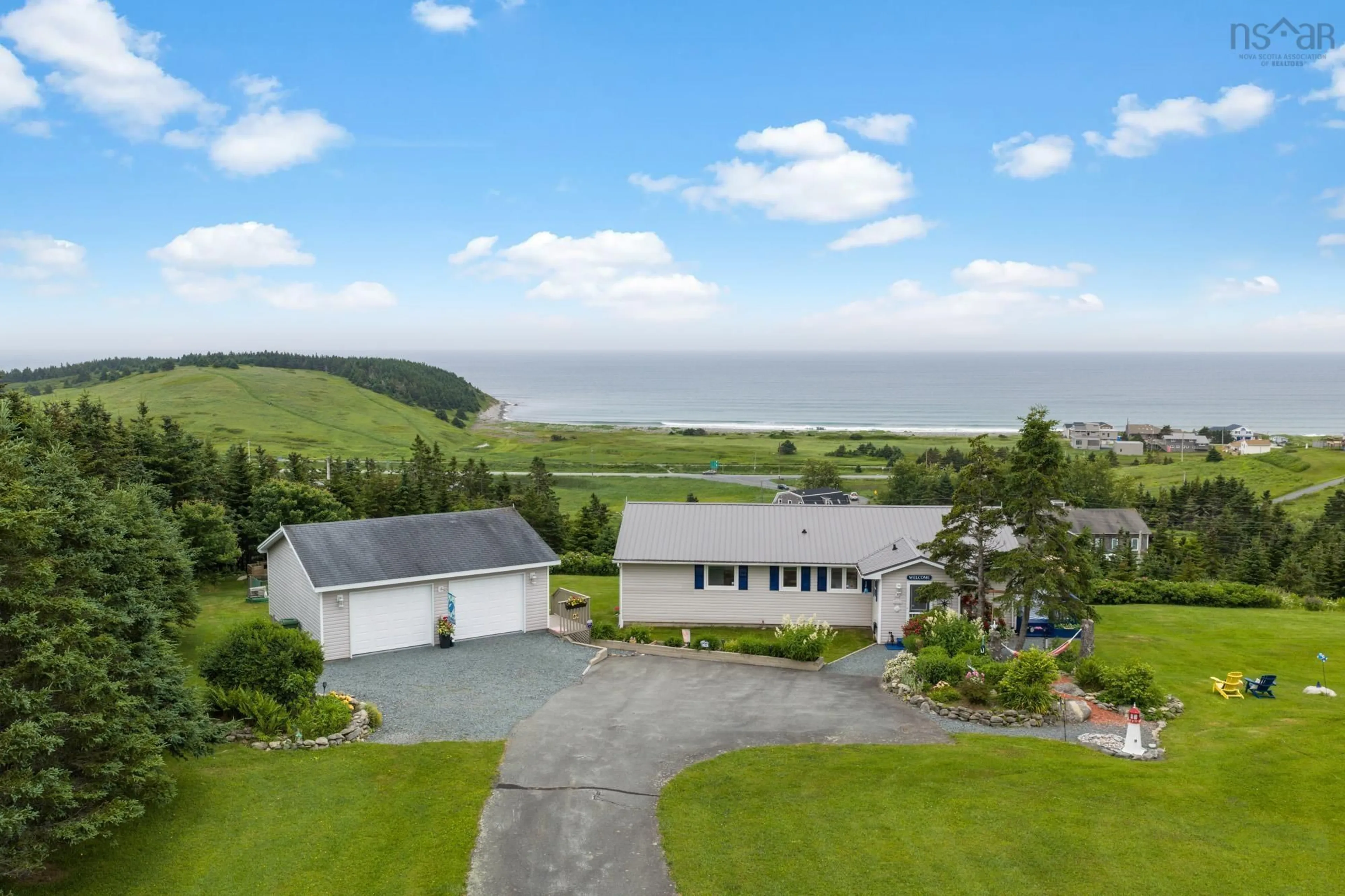 A pic from outside/outdoor area/front of a property/back of a property/a pic from drone, water/lake/river/ocean view for 9 Leeward Lane, East Lawrencetown Nova Scotia B2Z 1V2
