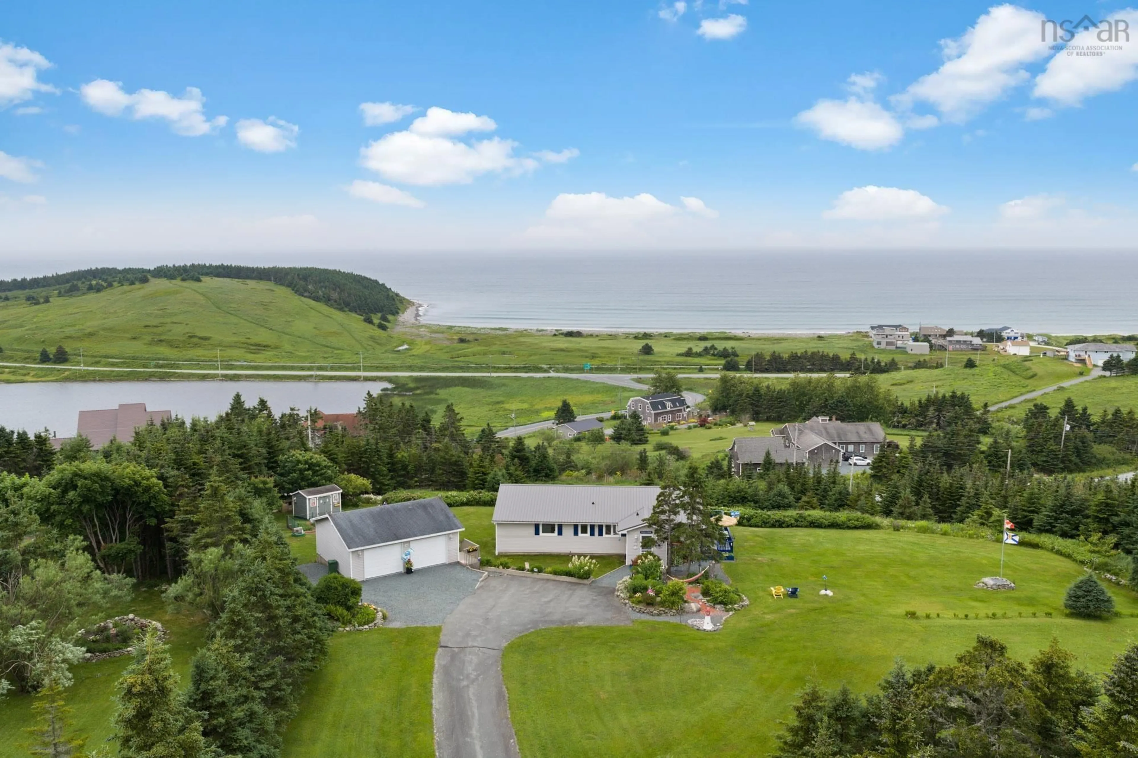 A pic from outside/outdoor area/front of a property/back of a property/a pic from drone, water/lake/river/ocean view for 9 Leeward Lane, East Lawrencetown Nova Scotia B2Z 1V2