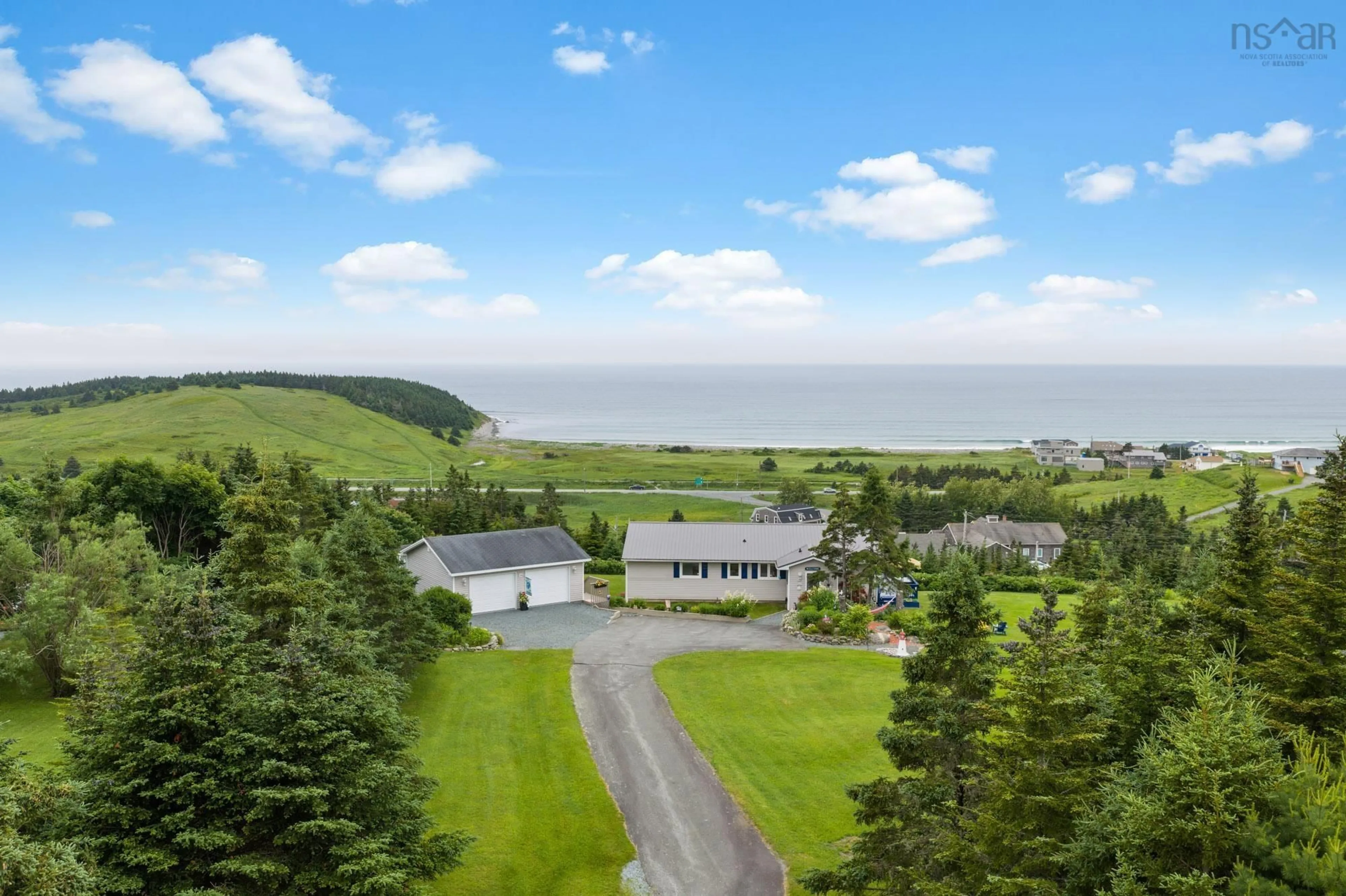 A pic from outside/outdoor area/front of a property/back of a property/a pic from drone, water/lake/river/ocean view for 9 Leeward Lane, East Lawrencetown Nova Scotia B2Z 1V2