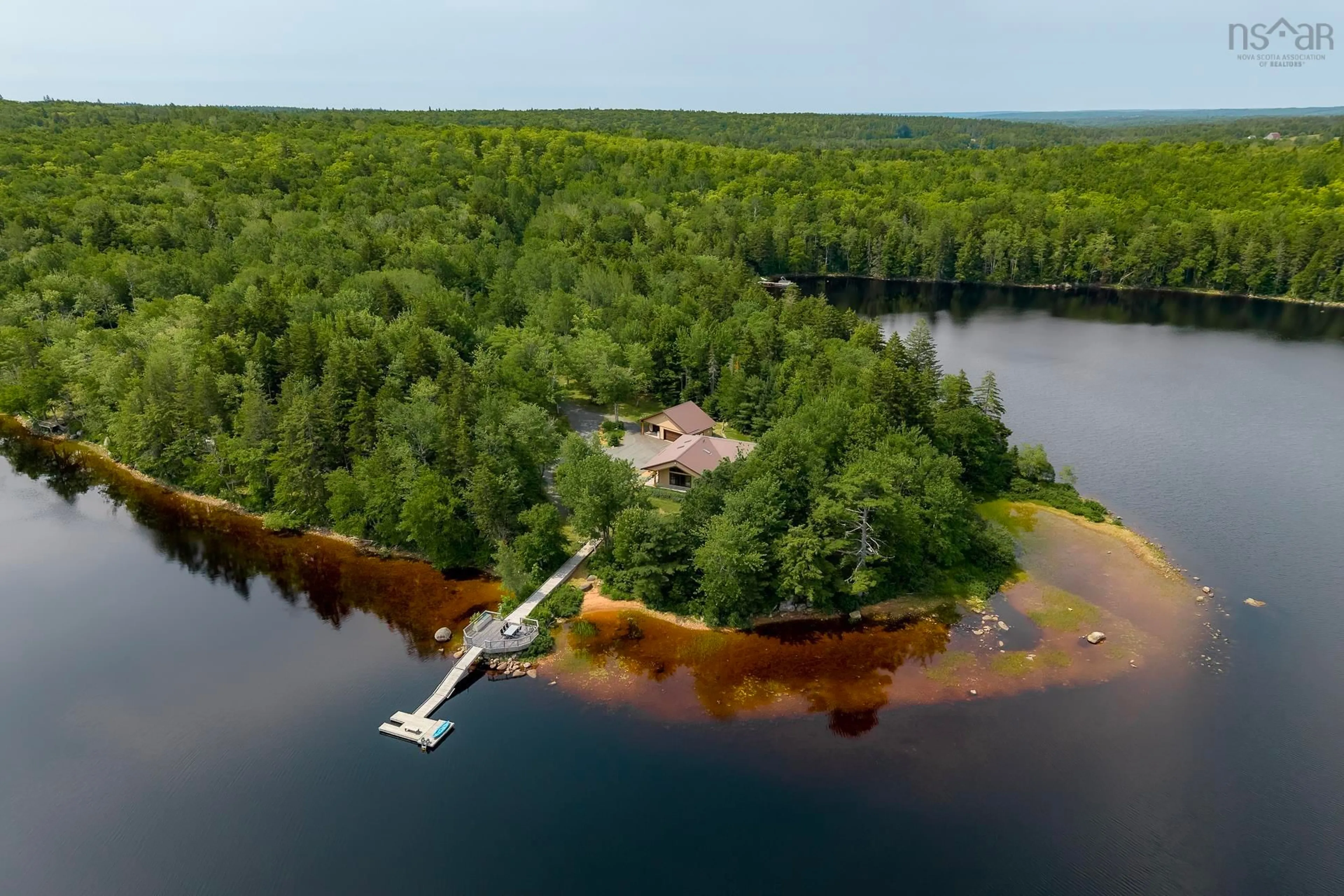 A pic from outside/outdoor area/front of a property/back of a property/a pic from drone, water/lake/river/ocean view for 144 Lake Lewis Lane, New Russell Nova Scotia B0J 2M0