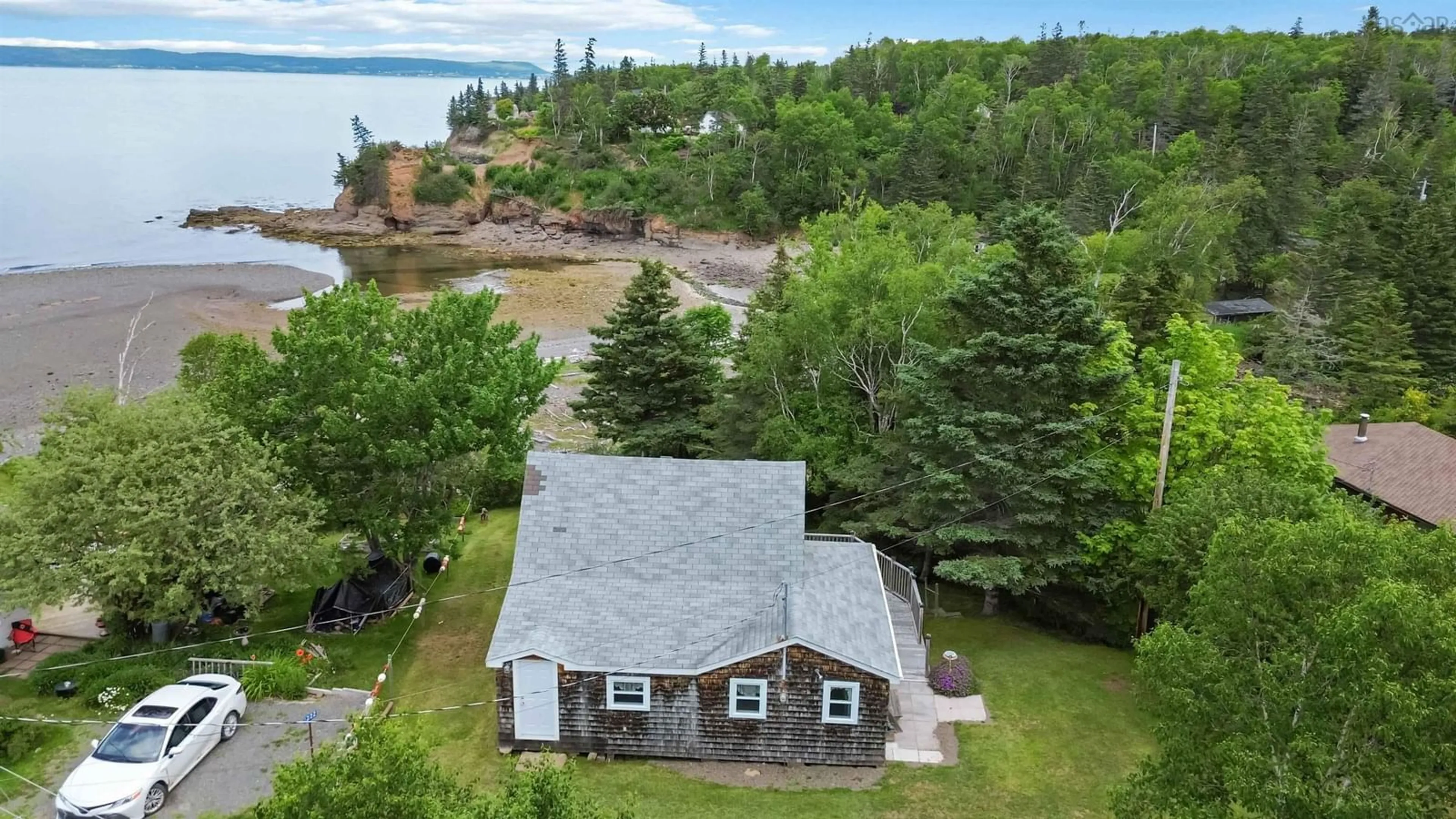 A pic from outside/outdoor area/front of a property/back of a property/a pic from drone, water/lake/river/ocean view for 1218 Bennetts Bay Rd, Bennett Bay Nova Scotia B0P 1H0