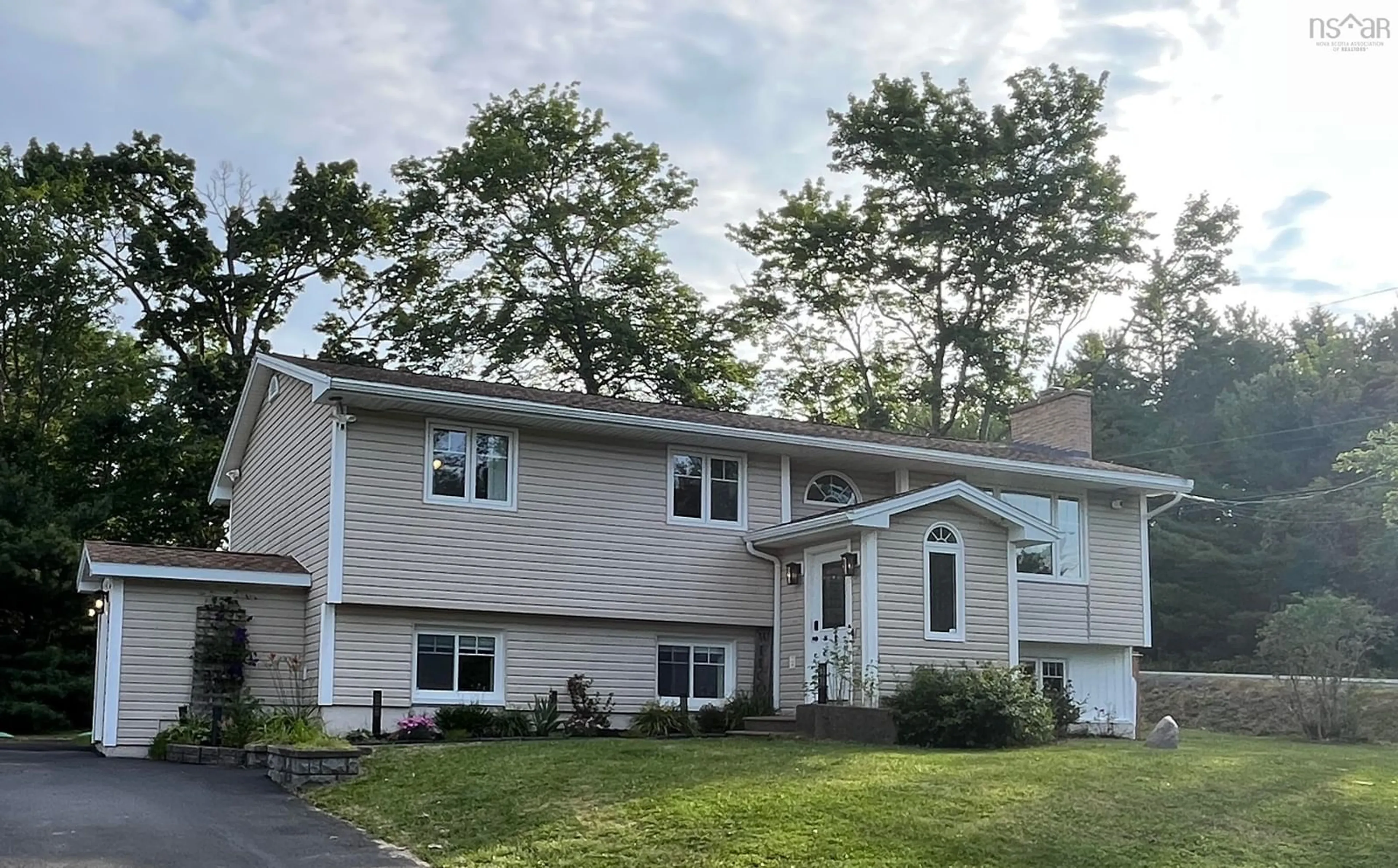Home with vinyl exterior material, street for 1 Brook St, Fletchers Lake Nova Scotia B2T 1A5