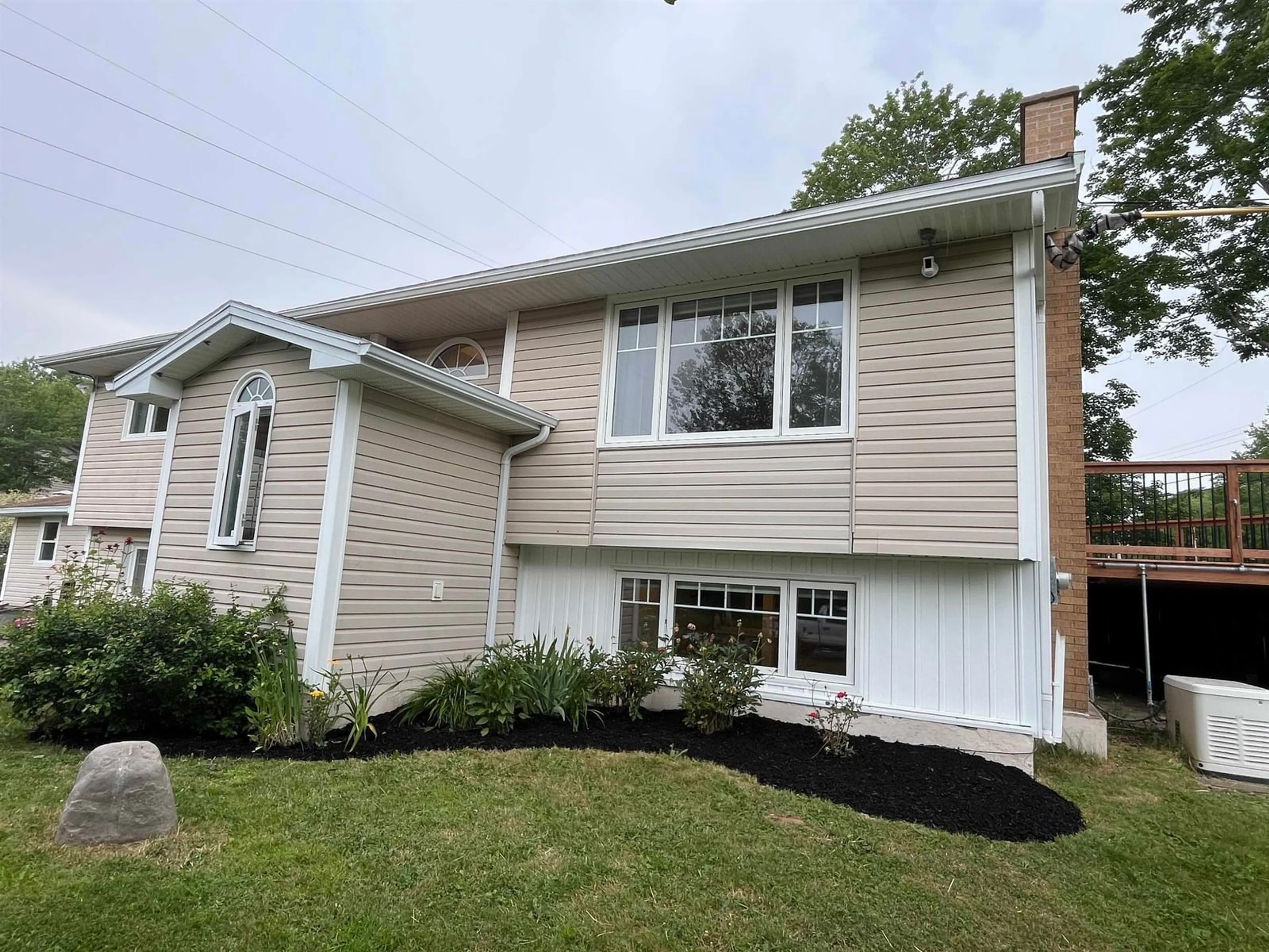 Home with vinyl exterior material, street for 1 Brook St, Fletchers Lake Nova Scotia B2T 1A5