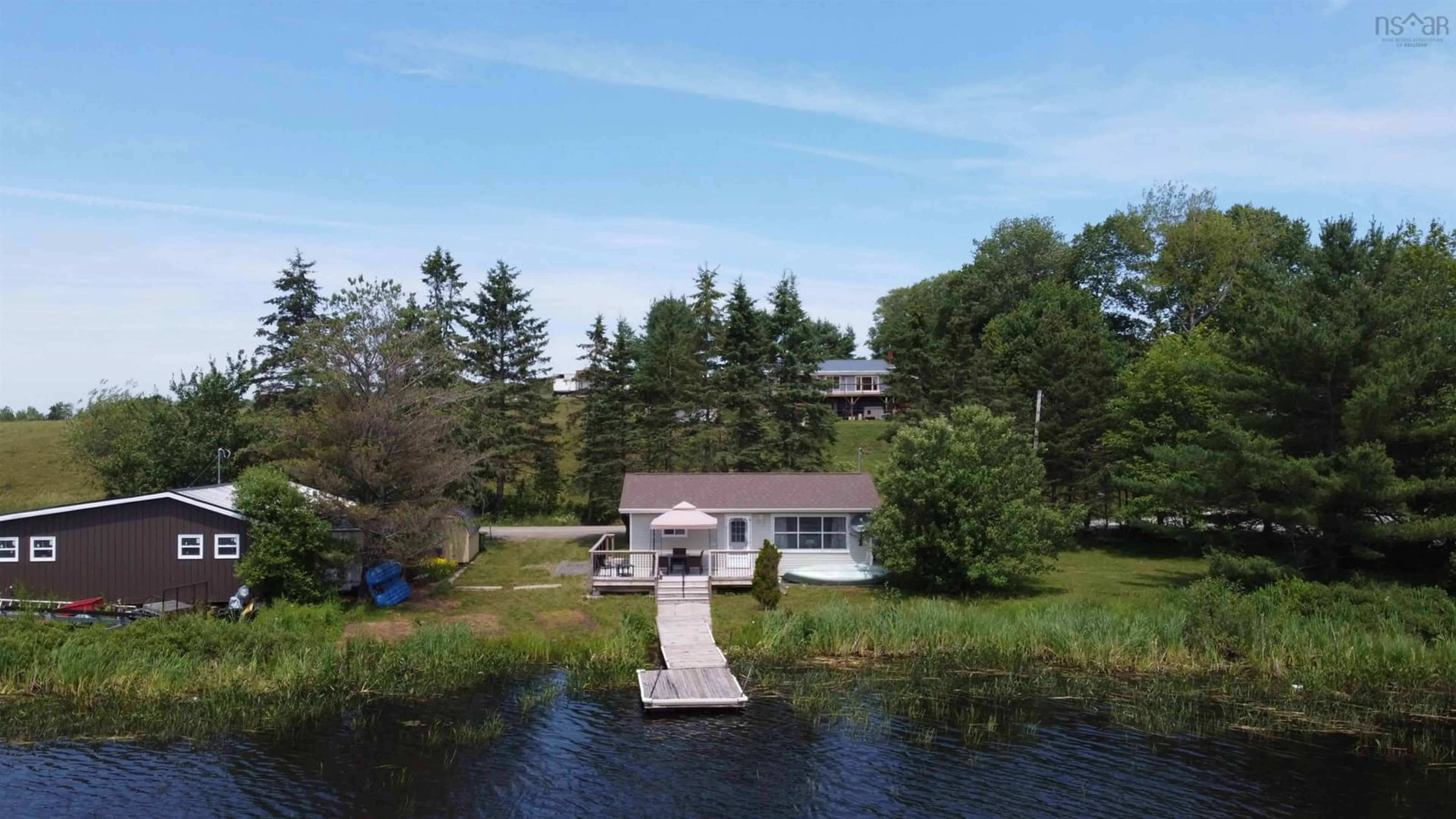 A pic from outside/outdoor area/front of a property/back of a property/a pic from drone, water/lake/river/ocean view for 251 Cottage Lane, Shortts Lake Nova Scotia B0N 1C0