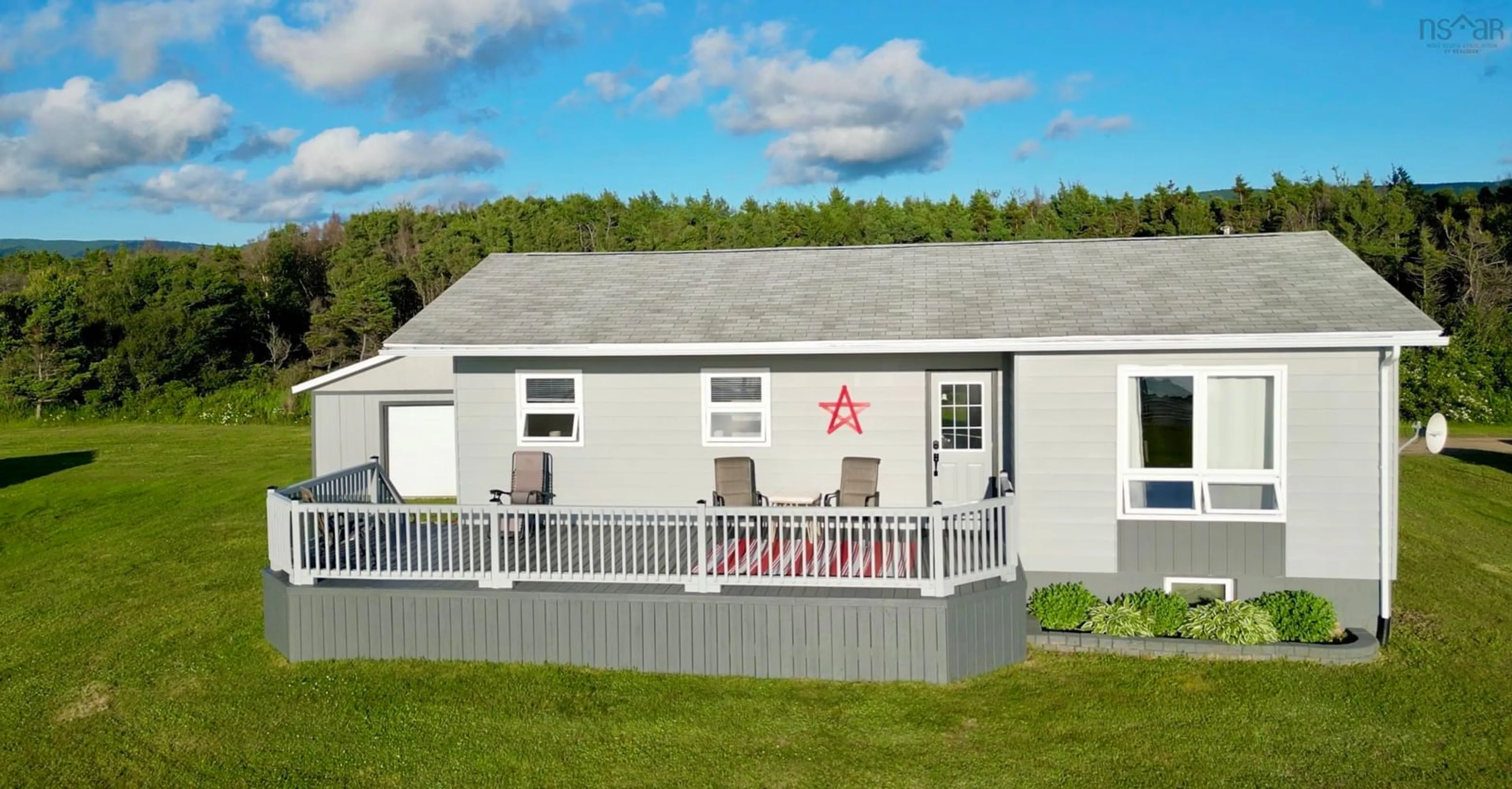 Home with vinyl exterior material, building for 23 Chemin Venette Road, Chéticamp Nova Scotia B0E 1H0