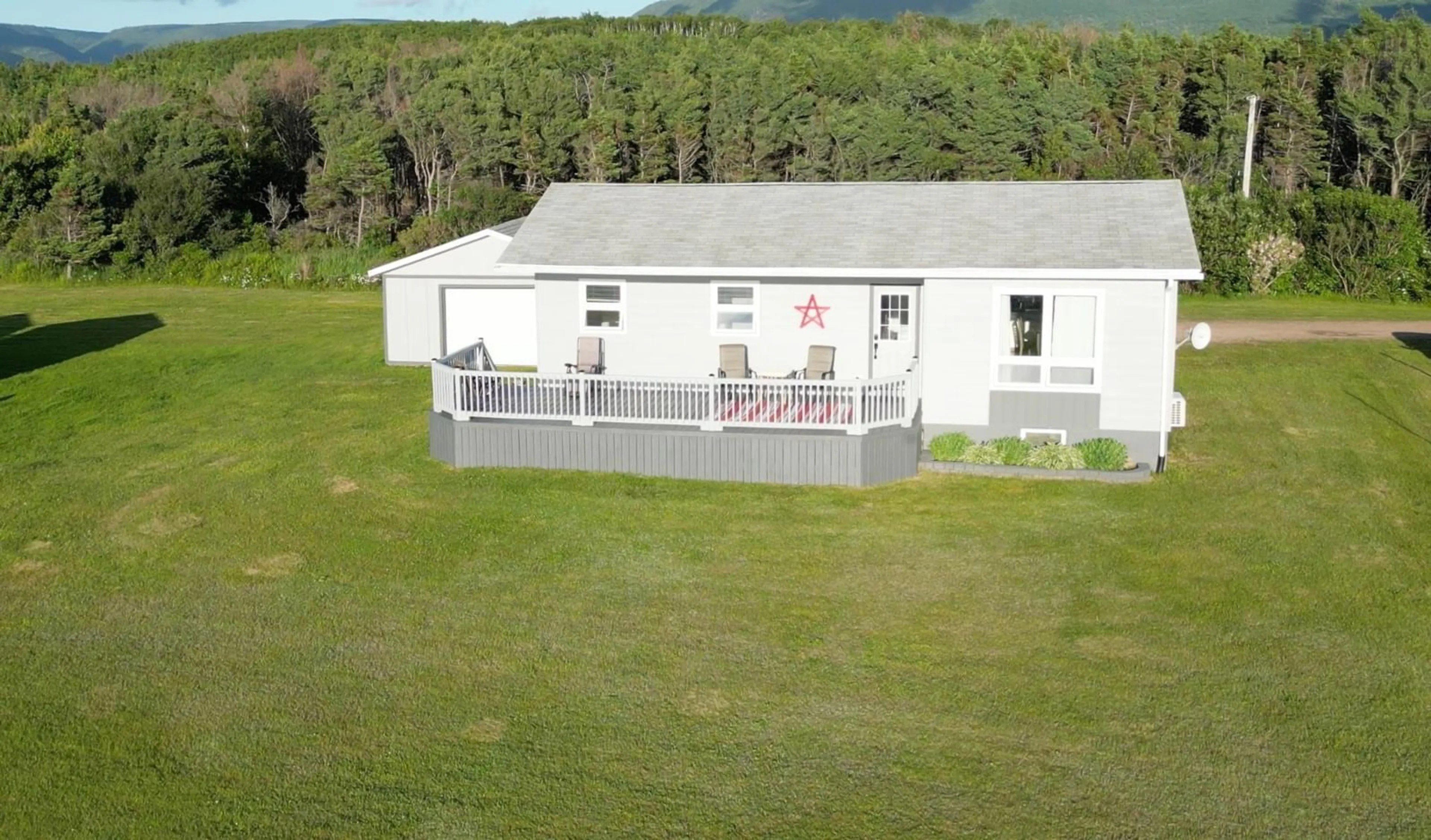 A pic from outside/outdoor area/front of a property/back of a property/a pic from drone, building for 23 Chemin Venette Road, Chéticamp Nova Scotia B0E 1H0
