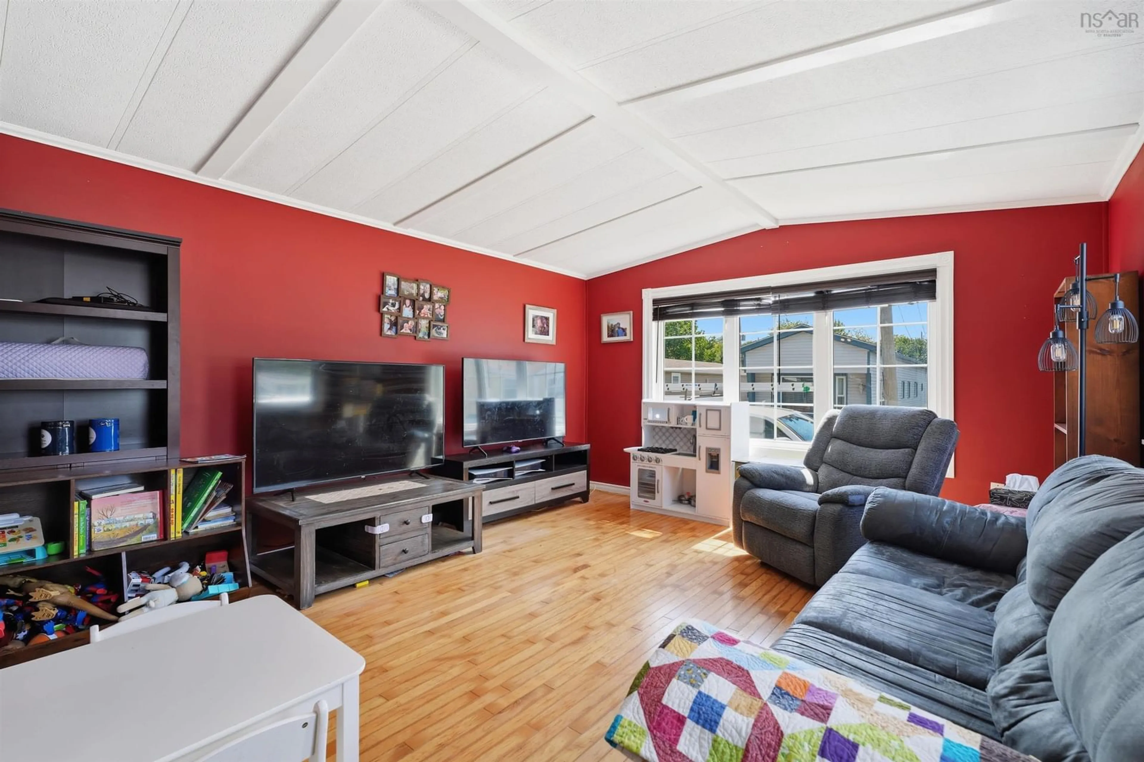 Living room with furniture, wood/laminate floor for 35 Glenda Cres, Fairview Nova Scotia B3M 2X6