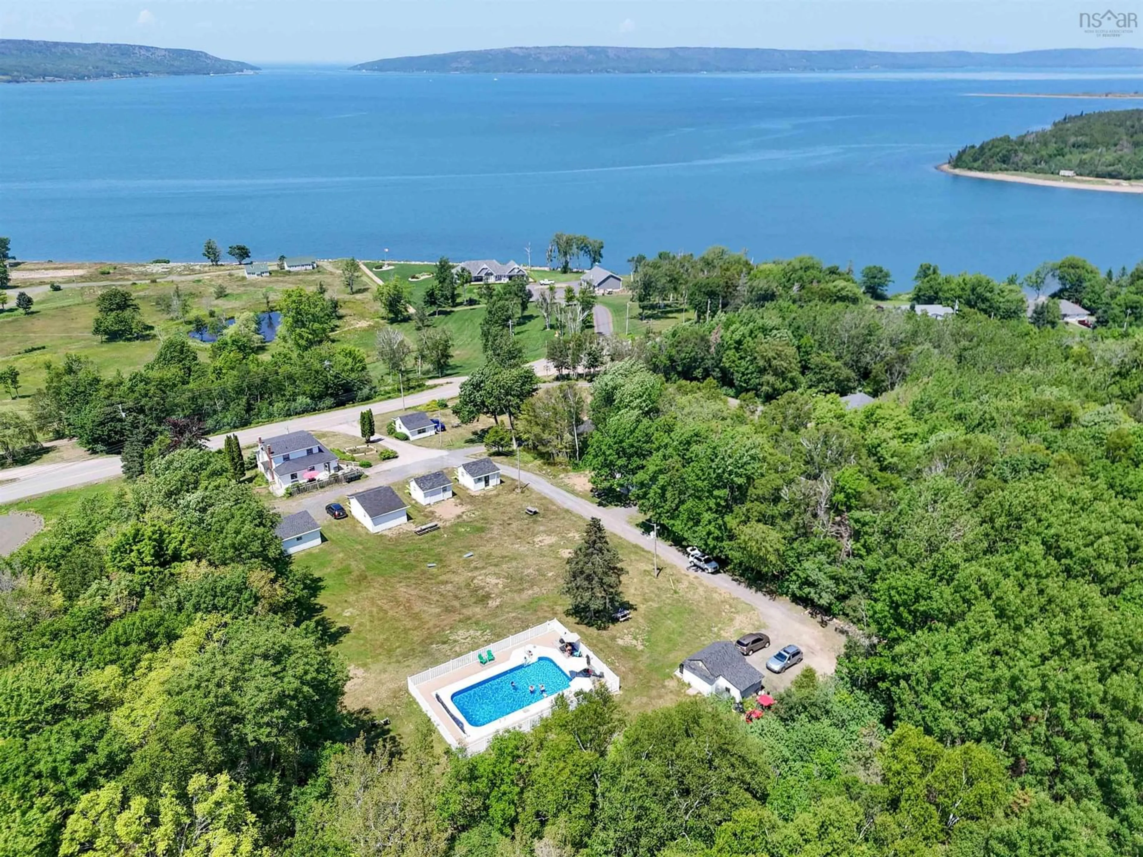 A pic from outside/outdoor area/front of a property/back of a property/a pic from drone, water/lake/river/ocean view for 234 Highway 1, Smiths Cove Nova Scotia B0S 1S0