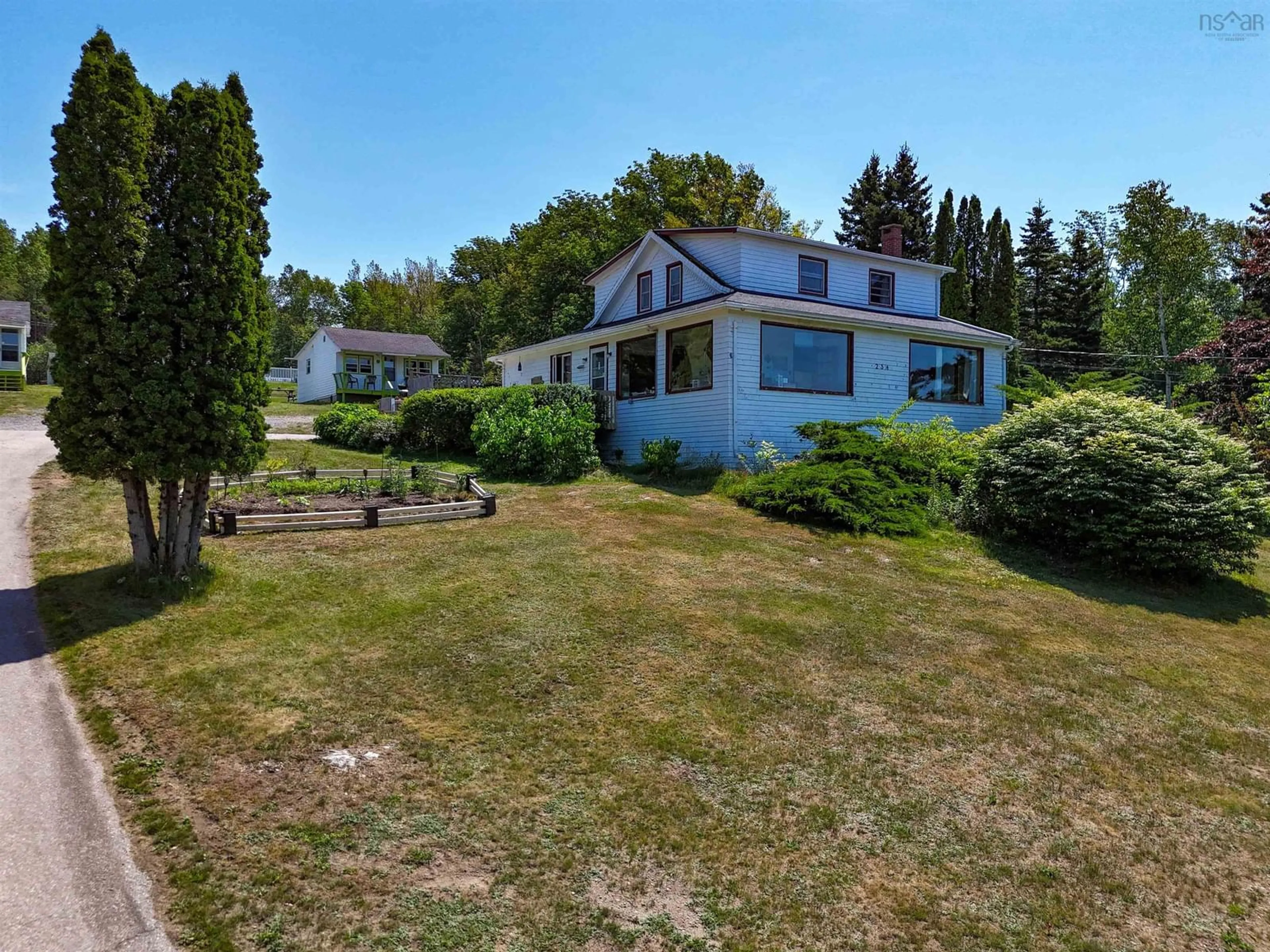 A pic from outside/outdoor area/front of a property/back of a property/a pic from drone, water/lake/river/ocean view for 234 Highway 1, Smiths Cove Nova Scotia B0S 1S0