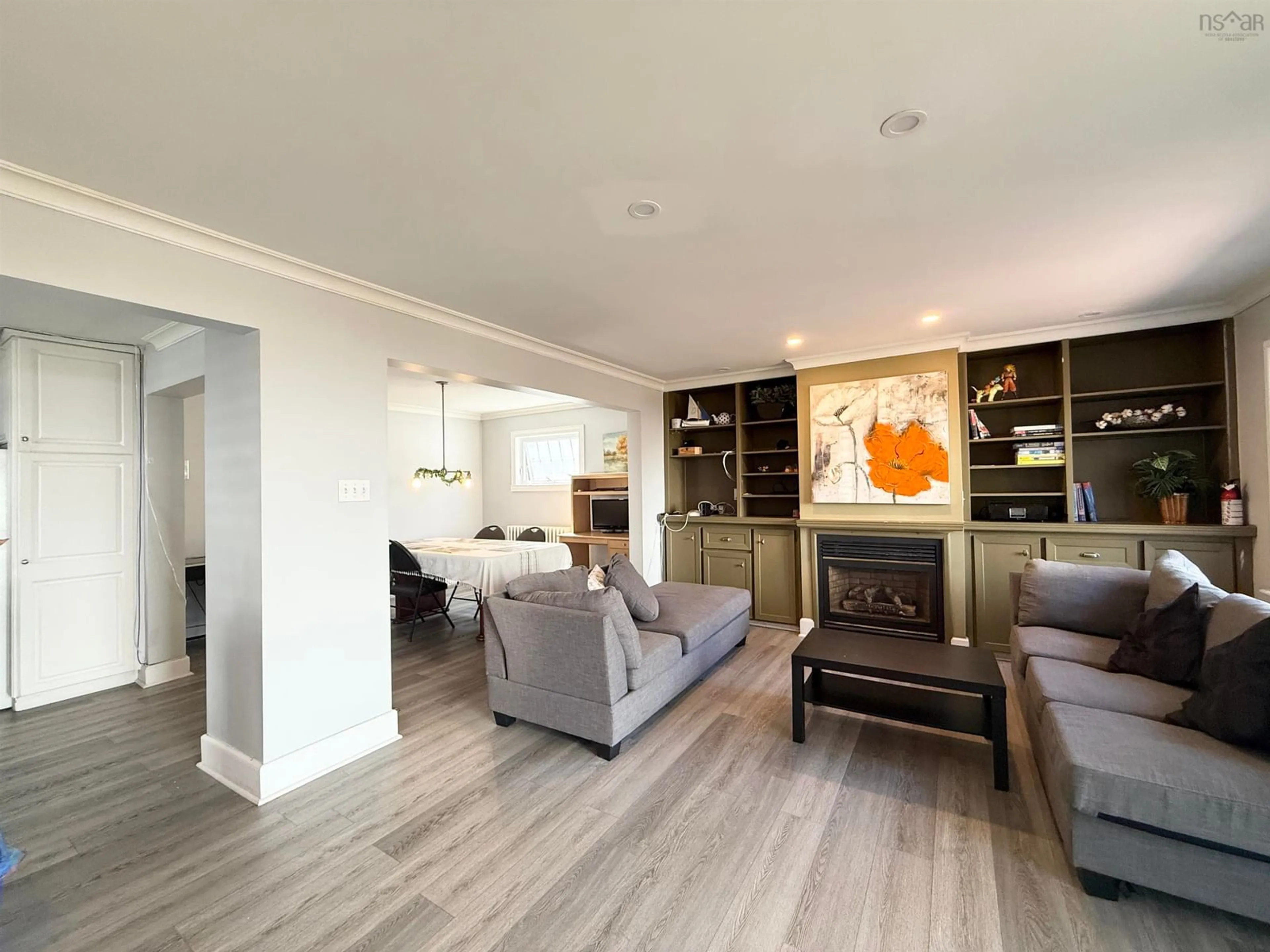 Living room with furniture, wood/laminate floor for Mclean St #974, Halifax Nova Scotia B3H 2V1