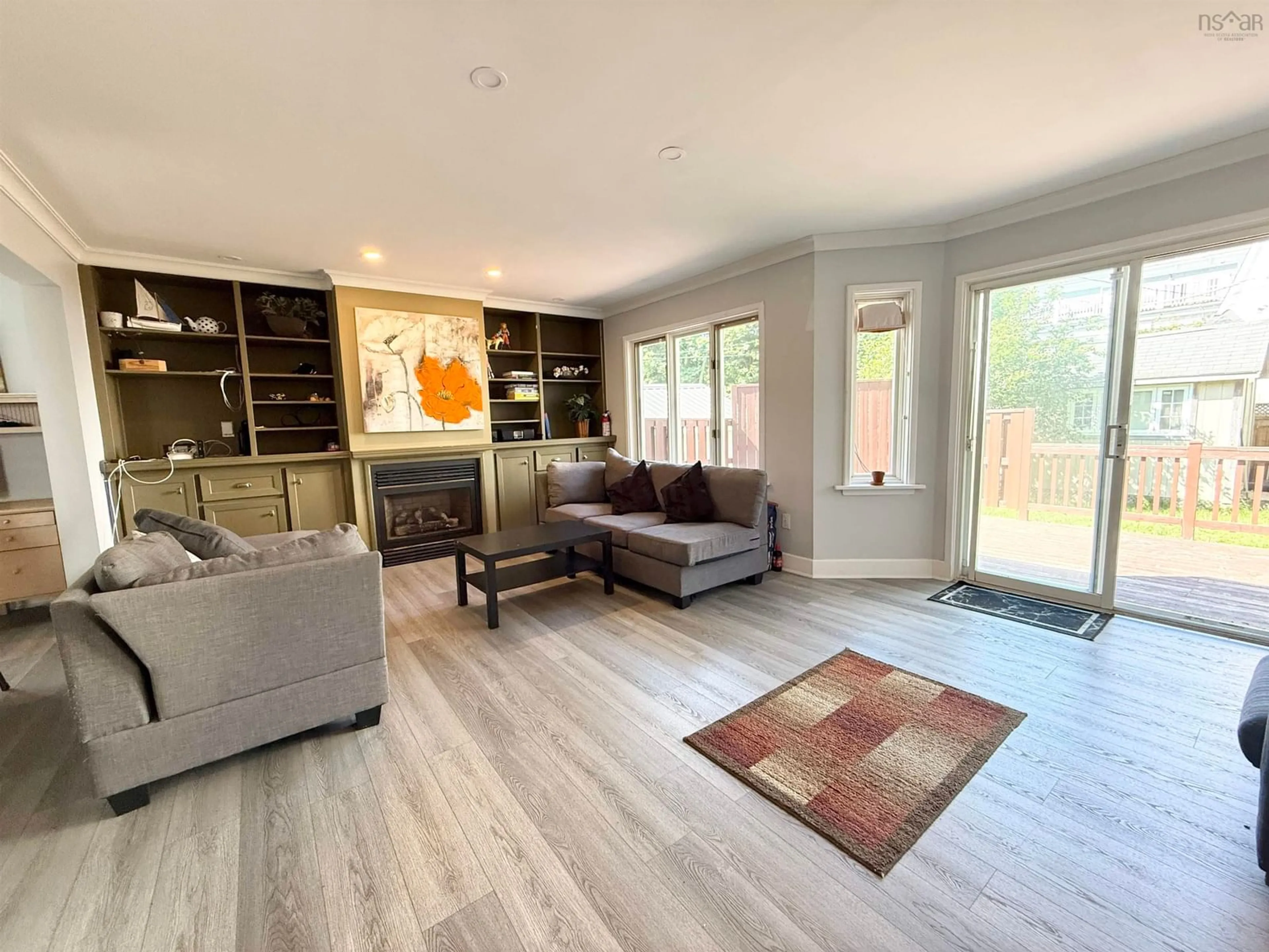 Living room with furniture, wood/laminate floor for Mclean St #974, Halifax Nova Scotia B3H 2V1