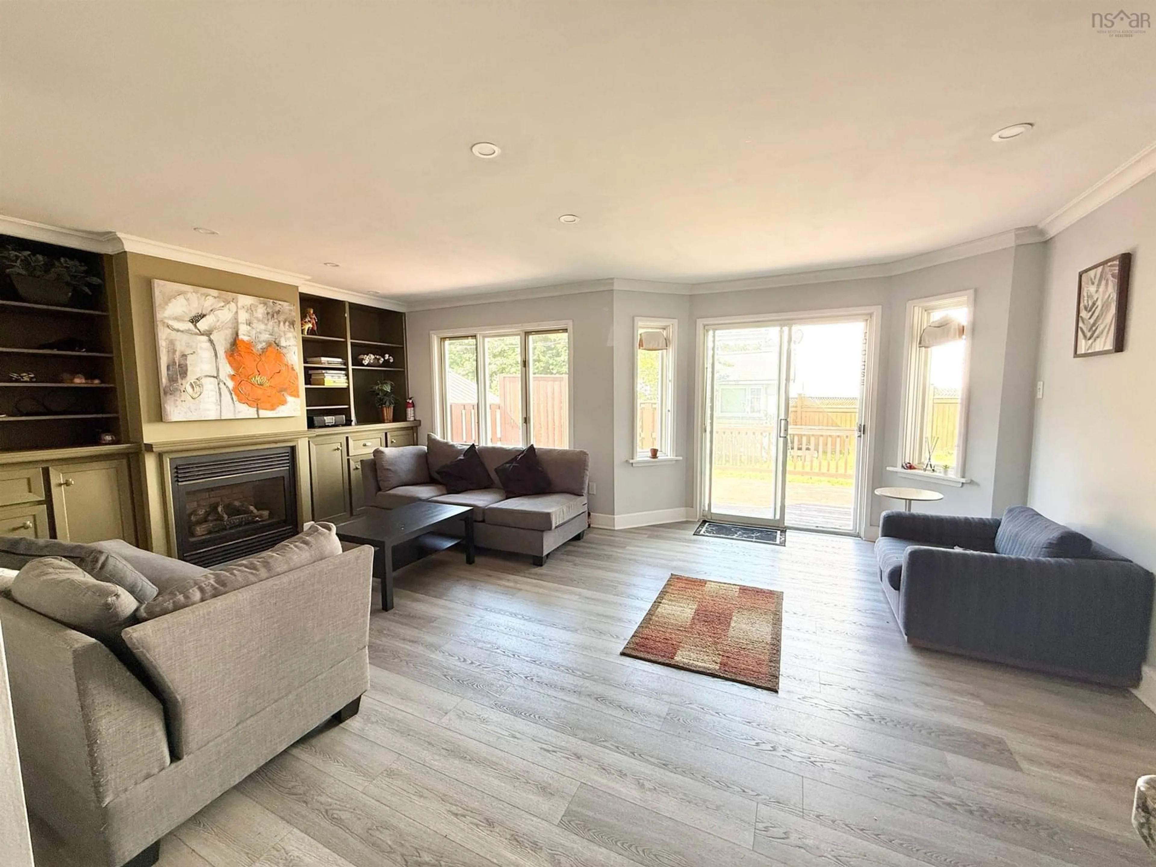 Living room with furniture, wood/laminate floor for Mclean St #974, Halifax Nova Scotia B3H 2V1