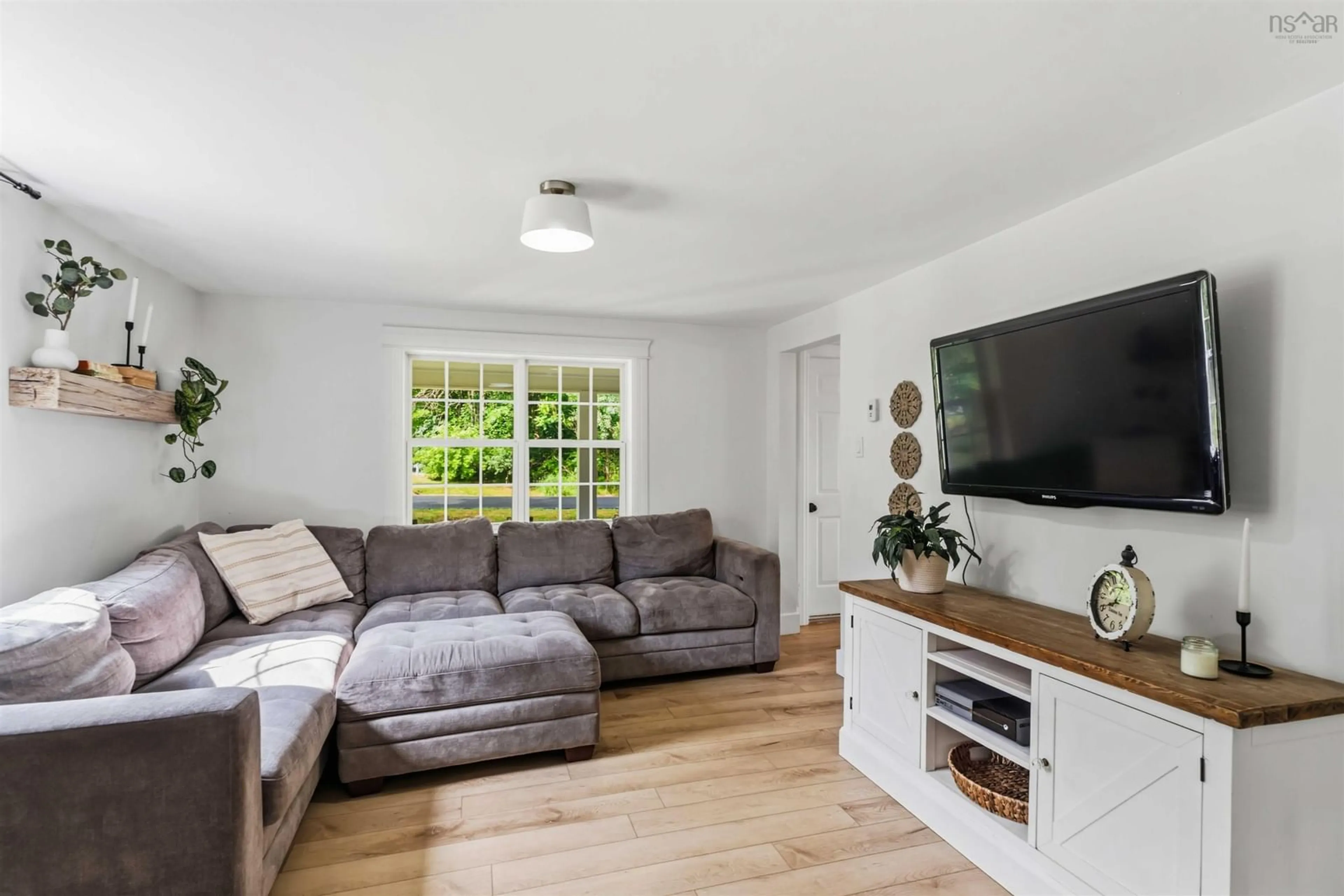 Living room with furniture, wood/laminate floor for 17 Kendall Lane, Currys Corner Nova Scotia B0N 2T0