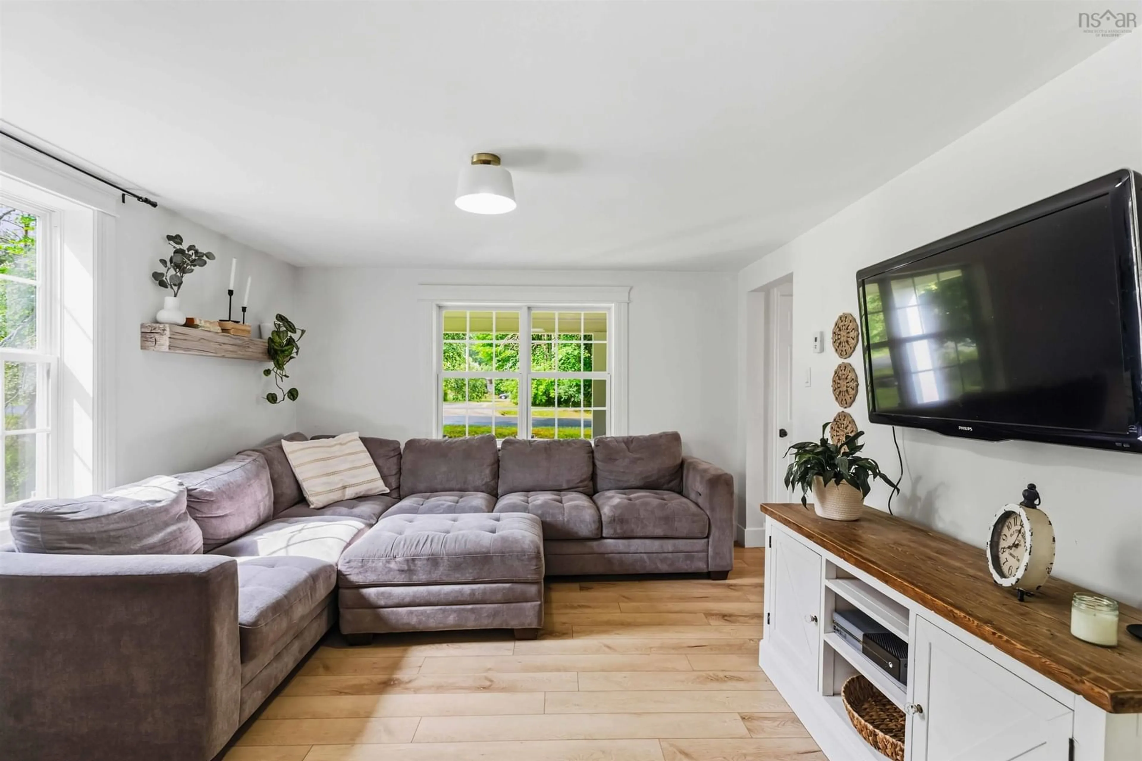Living room with furniture, wood/laminate floor for 17 Kendall Lane, Currys Corner Nova Scotia B0N 2T0