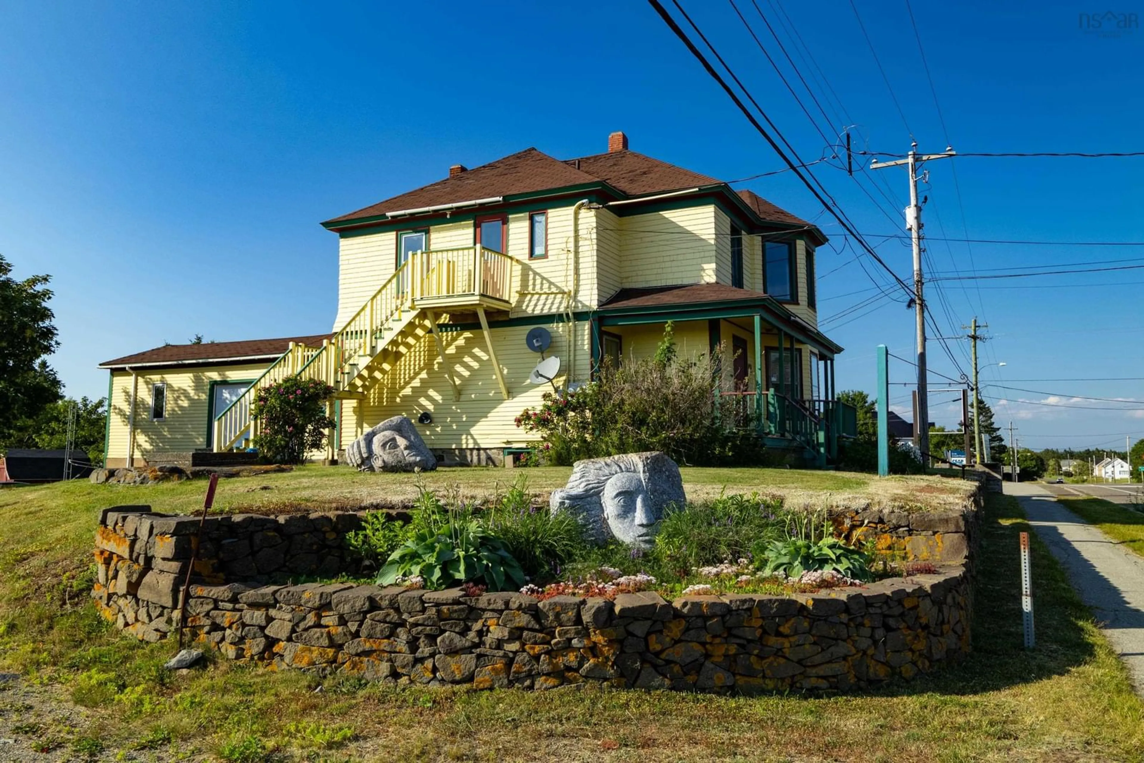 A pic from outside/outdoor area/front of a property/back of a property/a pic from drone, building for 1813 Highway 1, Church Point Nova Scotia B0W 1M0