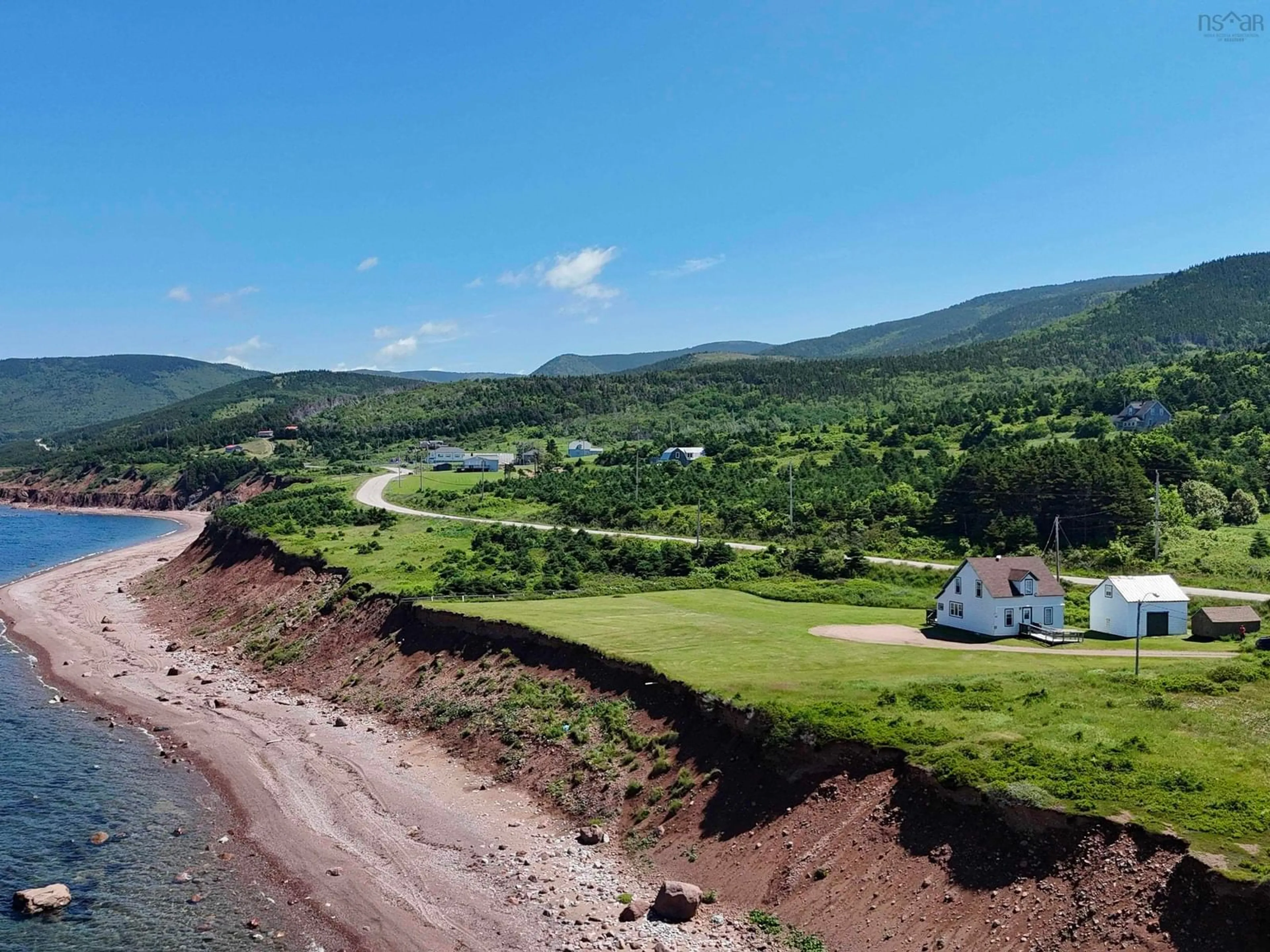 A pic from outside/outdoor area/front of a property/back of a property/a pic from drone, water/lake/river/ocean view for 355 Red River Rd., Pleasant Bay Nova Scotia B0E 2P0