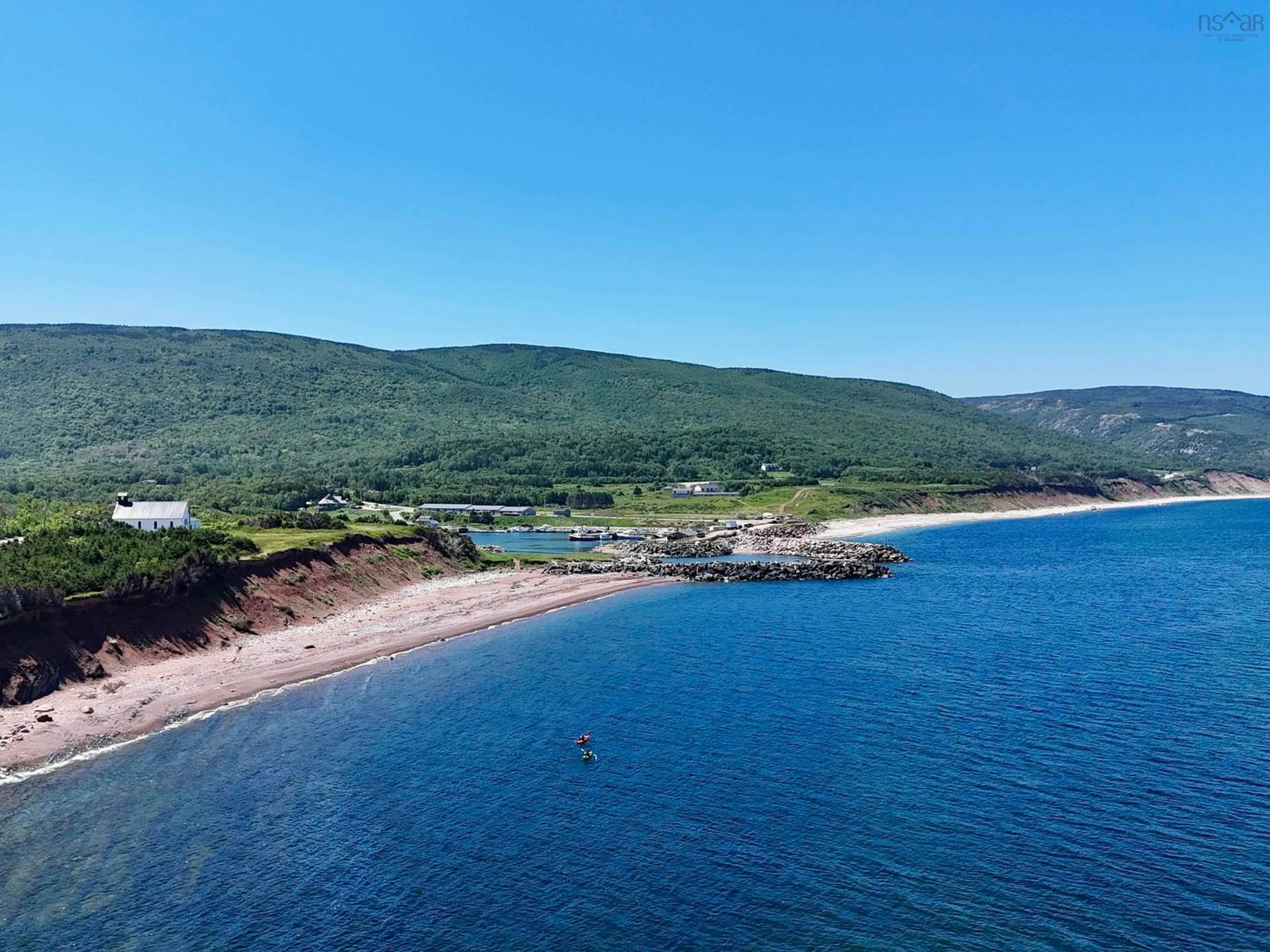 A pic from outside/outdoor area/front of a property/back of a property/a pic from drone, water/lake/river/ocean view for 355 Red River Rd., Pleasant Bay Nova Scotia B0E 2P0