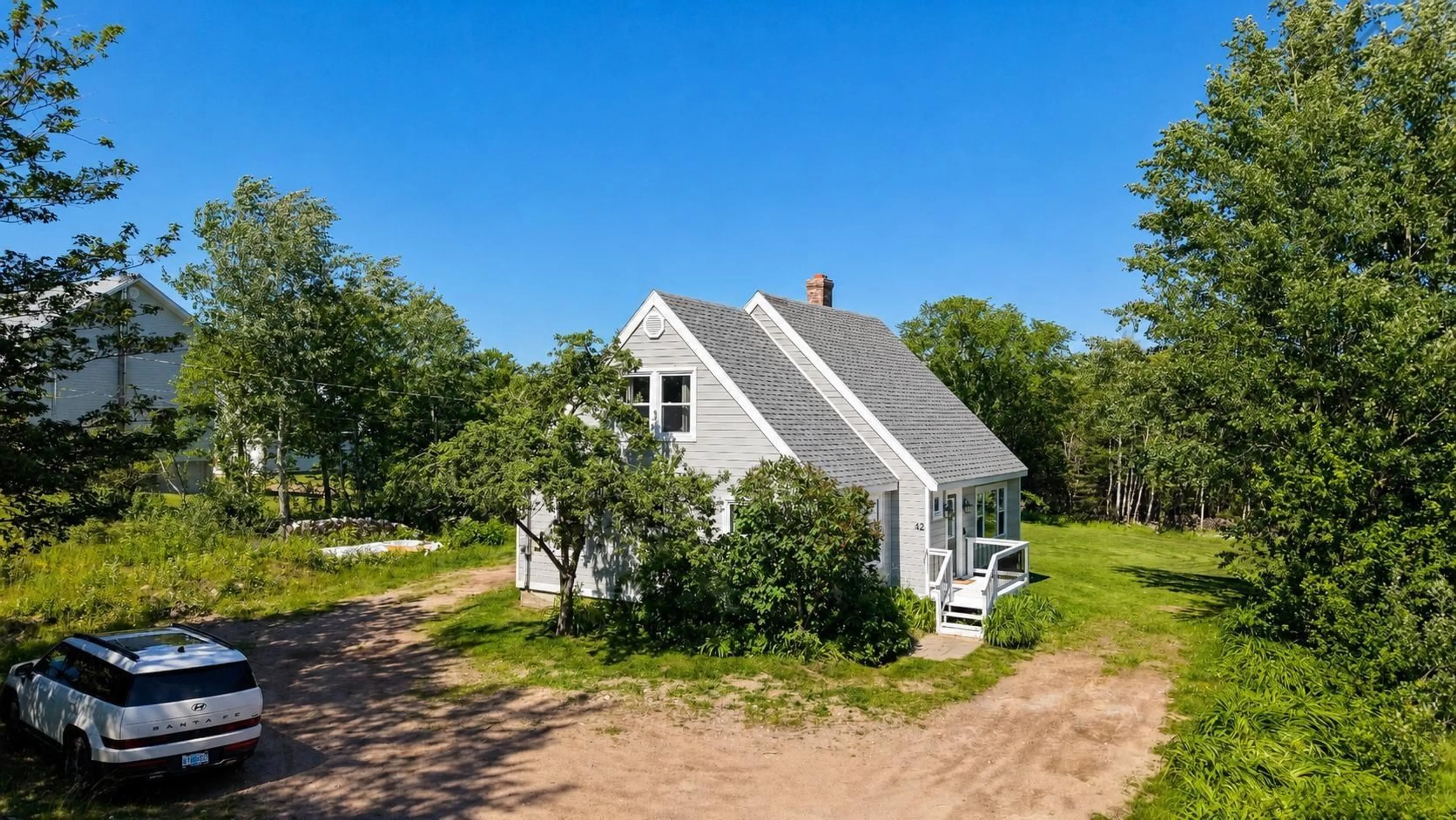 A pic from outside/outdoor area/front of a property/back of a property/a pic from drone, street for 42 Courtney Rd, Cape North Nova Scotia B0C 1G0
