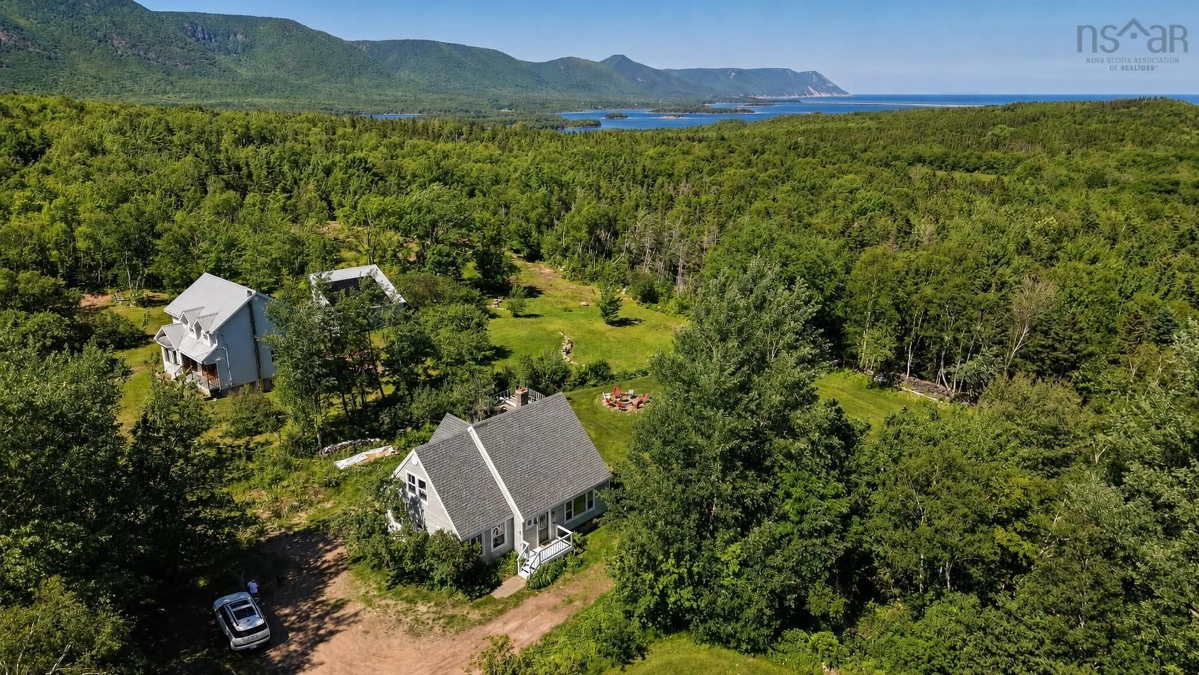 A pic from outside/outdoor area/front of a property/back of a property/a pic from drone, water/lake/river/ocean view for 42 Courtney Rd, Cape North Nova Scotia B0C 1G0