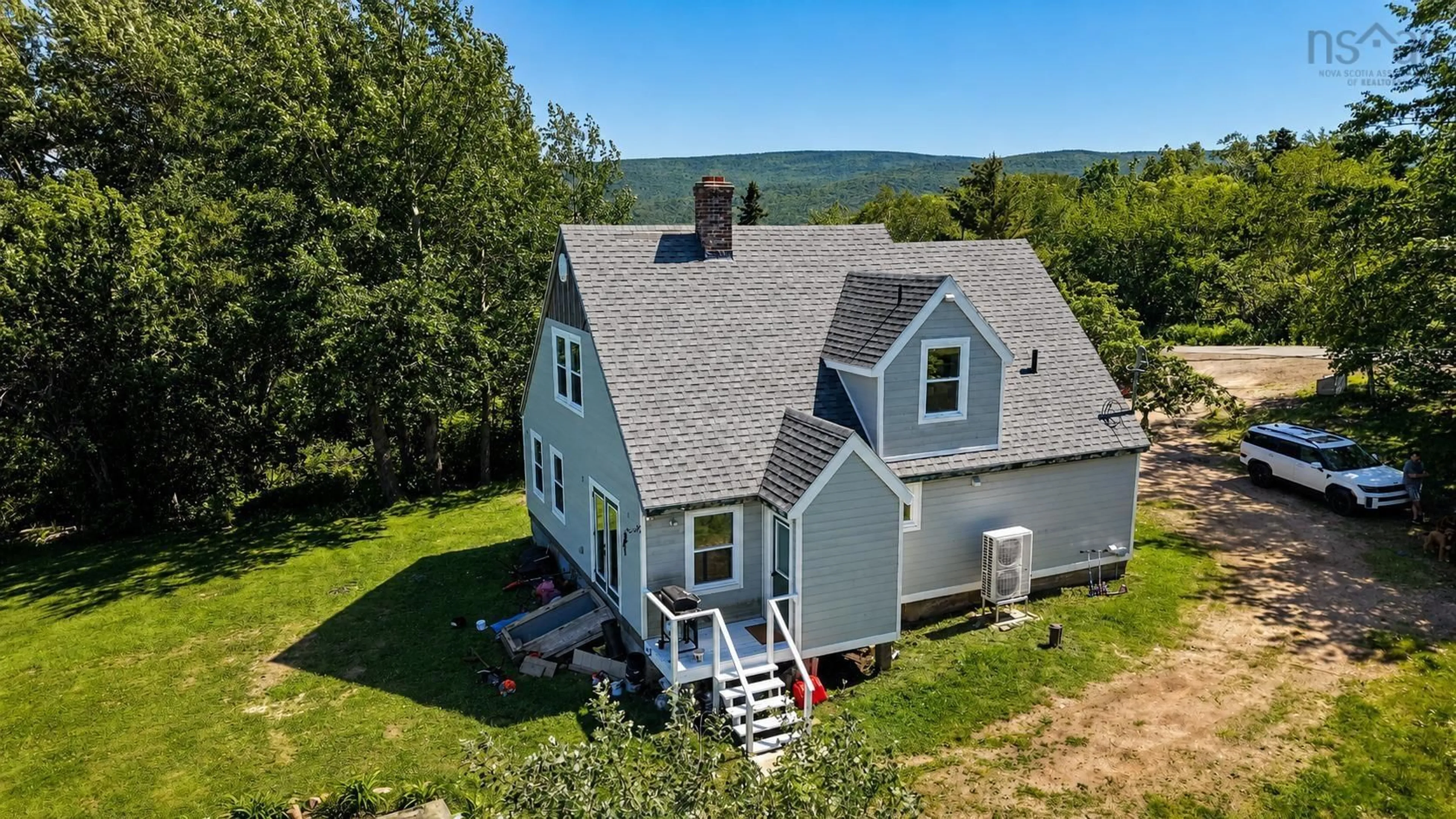 A pic from outside/outdoor area/front of a property/back of a property/a pic from drone, water/lake/river/ocean view for 42 Courtney Rd, Cape North Nova Scotia B0C 1G0