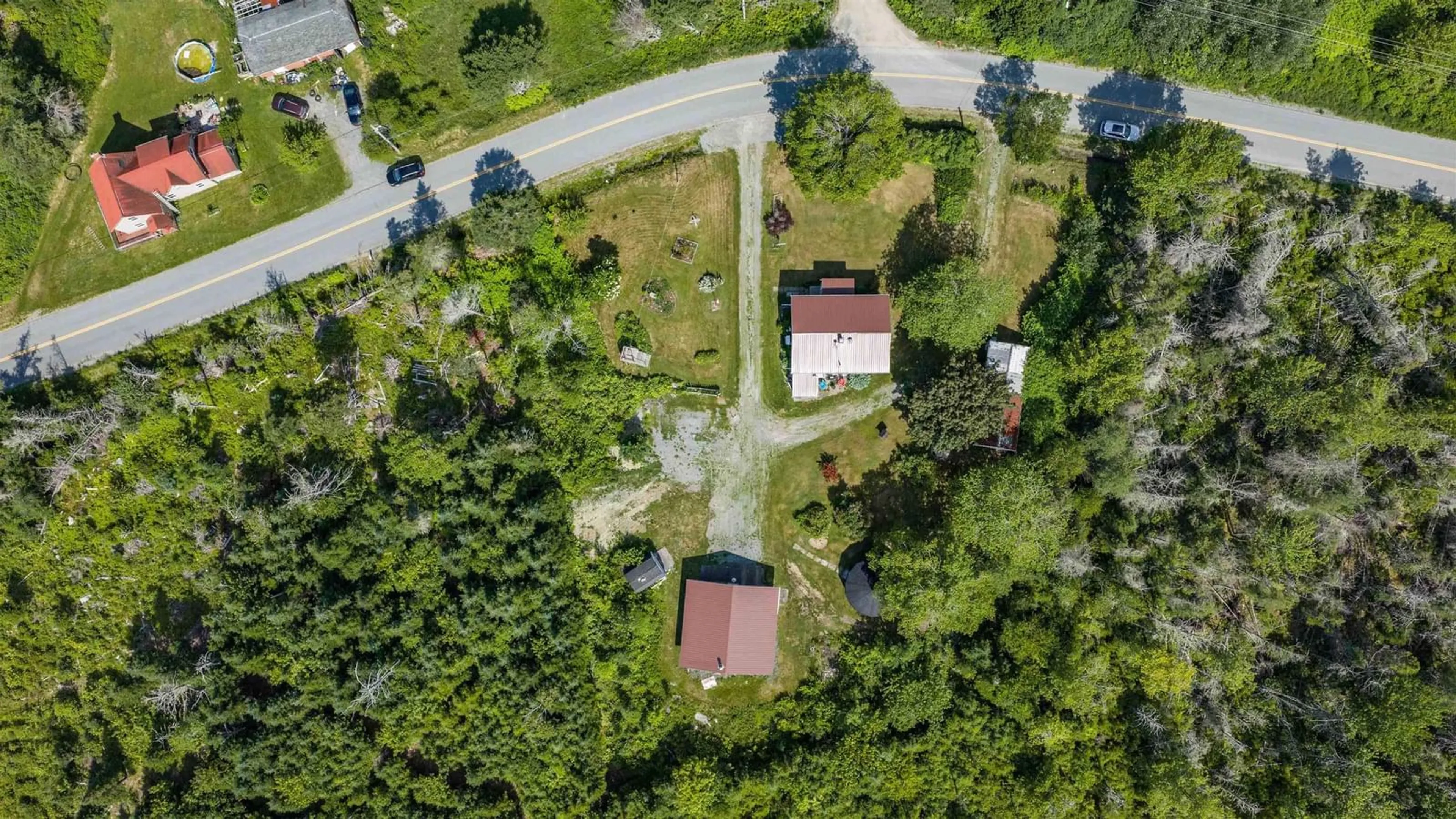A pic from outside/outdoor area/front of a property/back of a property/a pic from drone, street for 522 East River Rd, Sheet Harbour Nova Scotia B0J 3B0