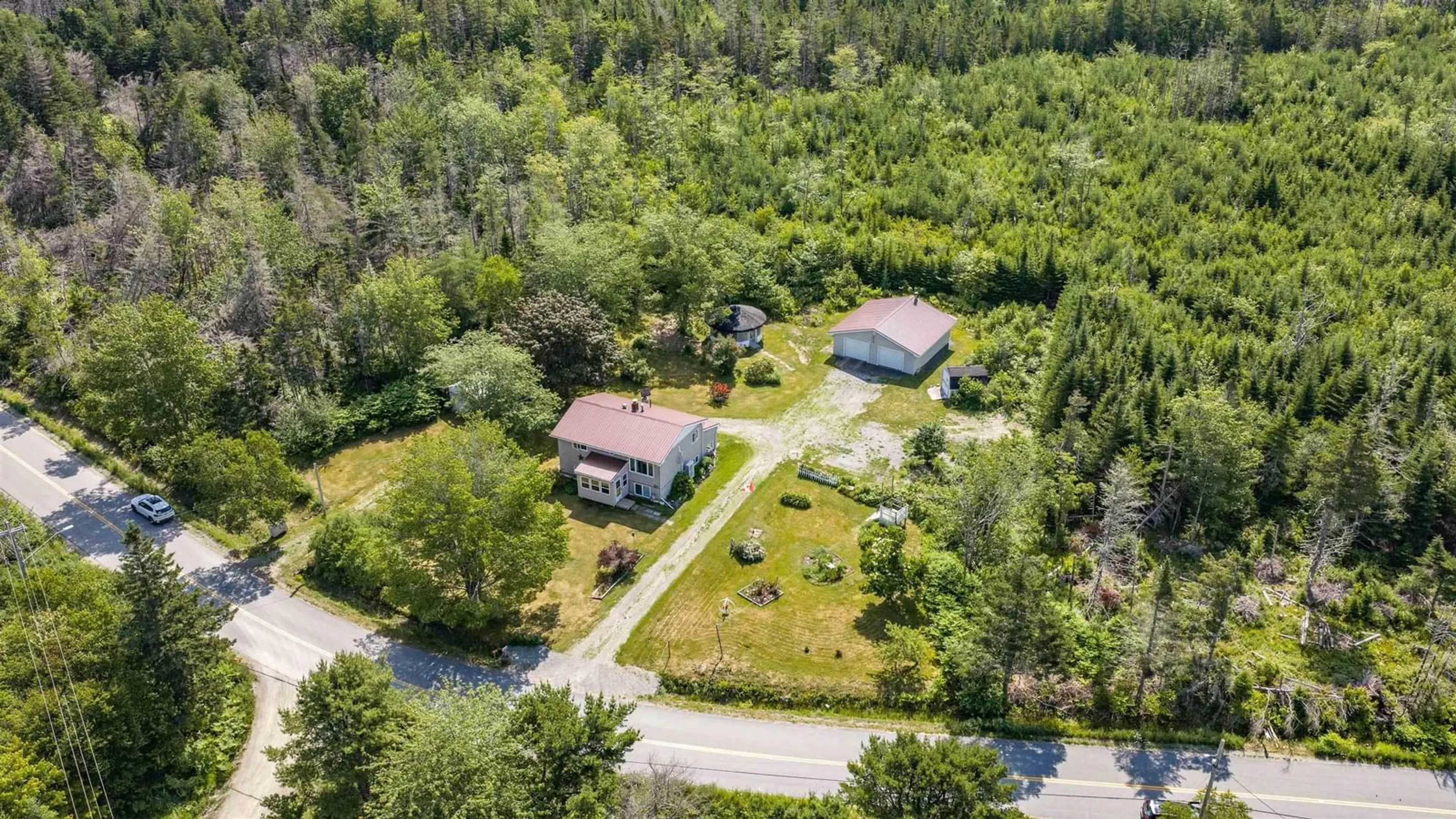 A pic from outside/outdoor area/front of a property/back of a property/a pic from drone, unknown for 522 East River Rd, Sheet Harbour Nova Scotia B0J 3B0
