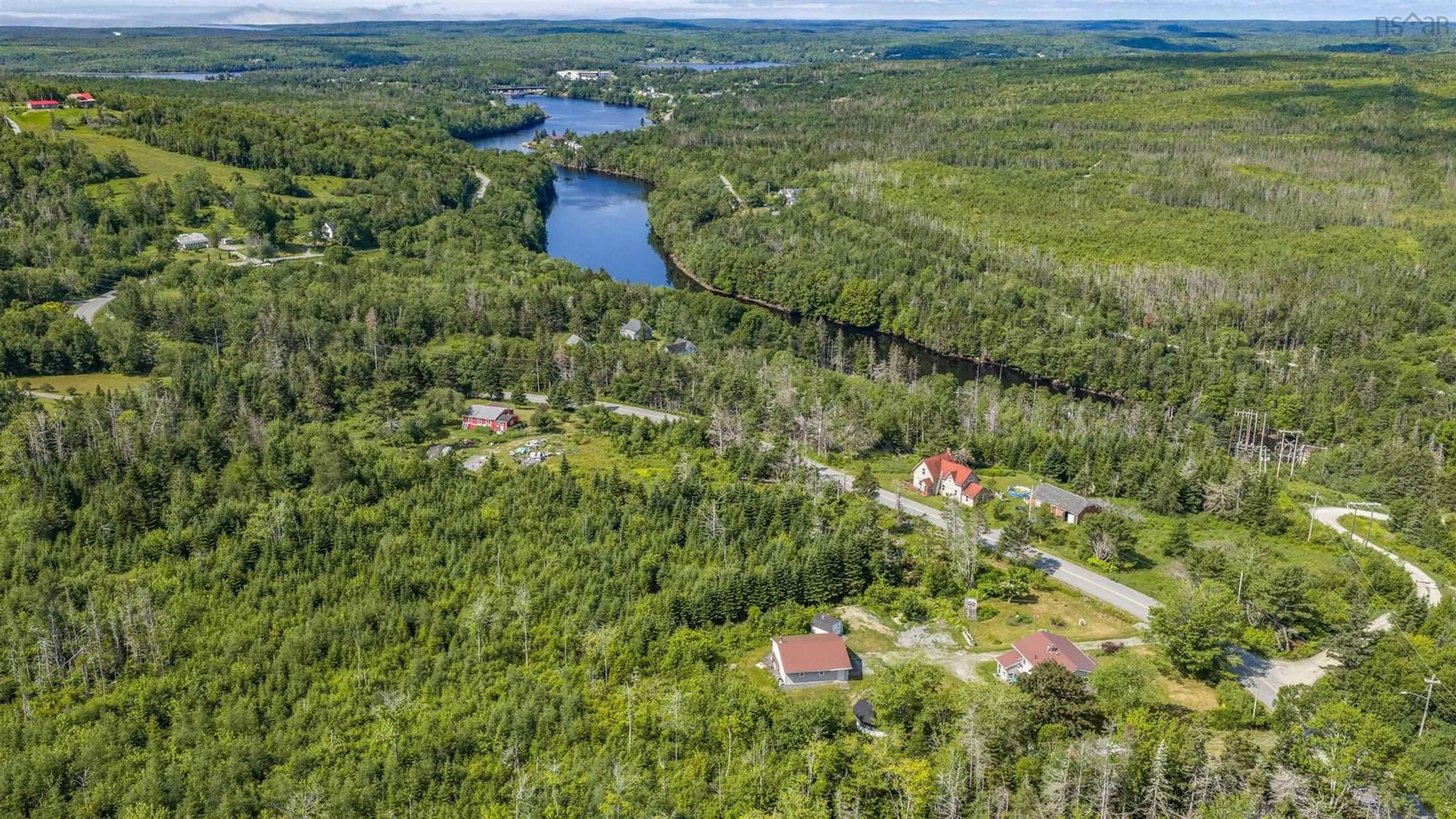 A pic from outside/outdoor area/front of a property/back of a property/a pic from drone, water/lake/river/ocean view for 522 East River Rd, Sheet Harbour Nova Scotia B0J 3B0