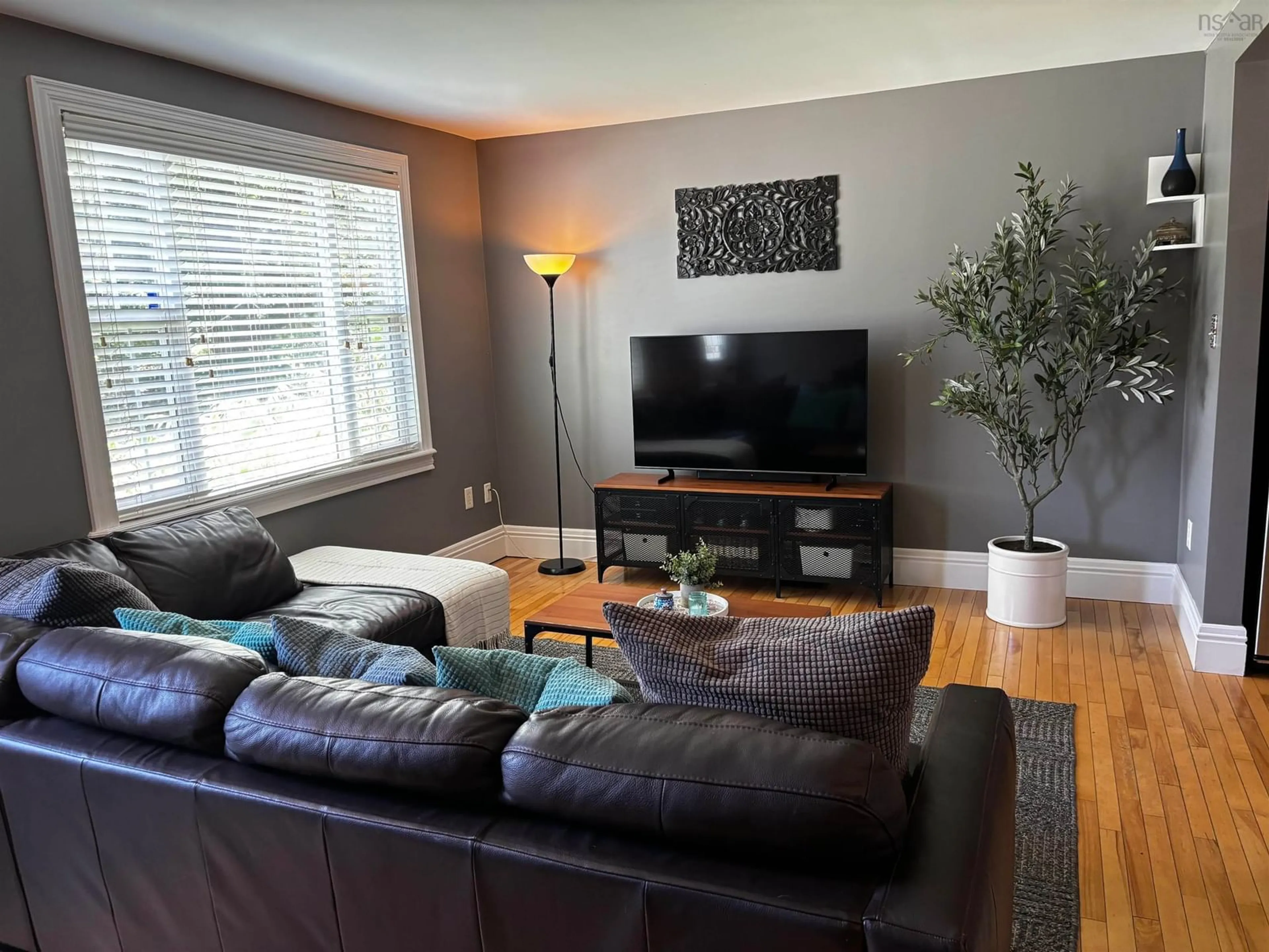 Living room with furniture, wood/laminate floor for 1 Stairs St, Dartmouth Nova Scotia B3A 3E8
