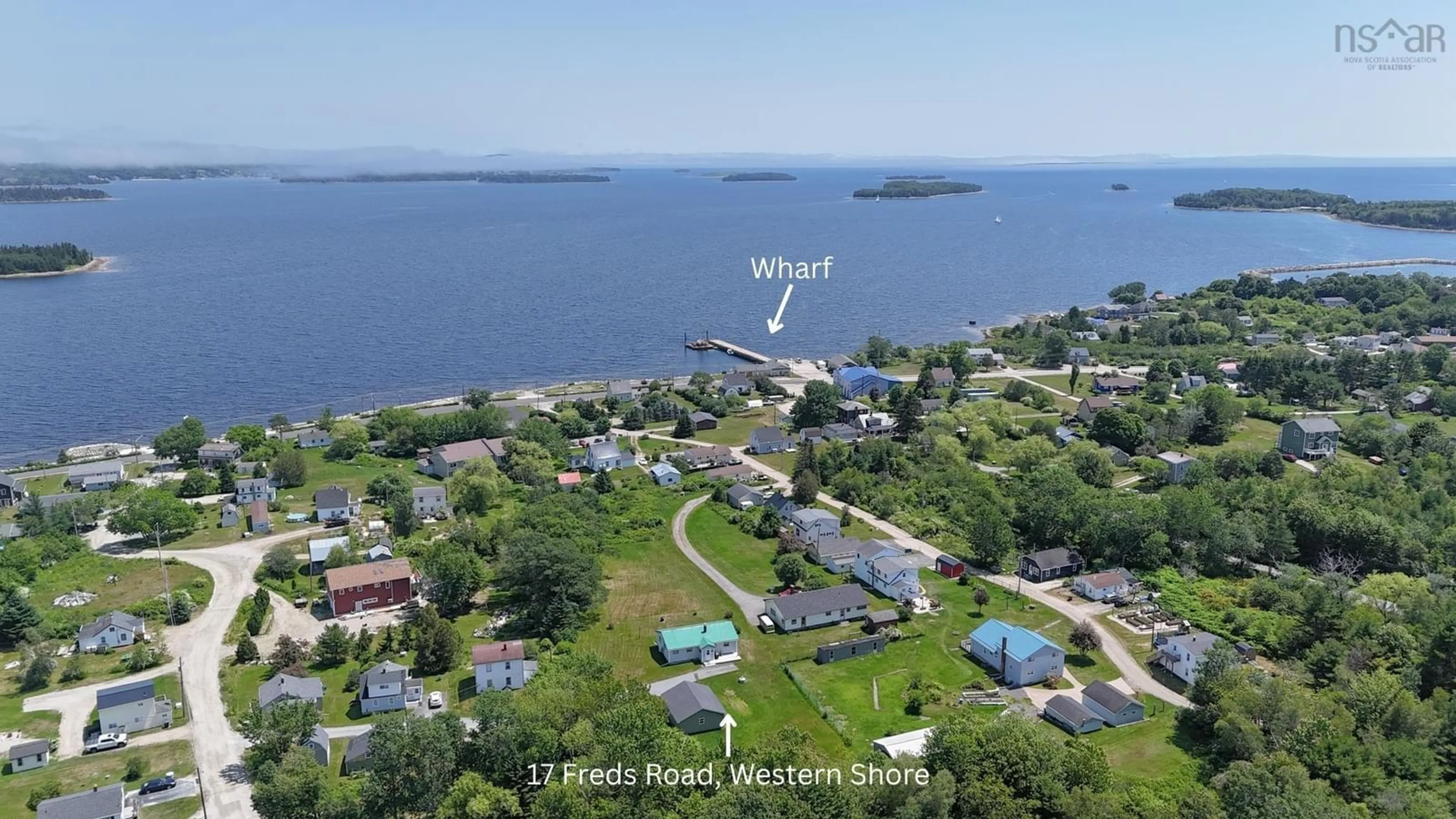 A pic from outside/outdoor area/front of a property/back of a property/a pic from drone, water/lake/river/ocean view for 17 Freds Rd, Western Shore Nova Scotia B0J 1K0