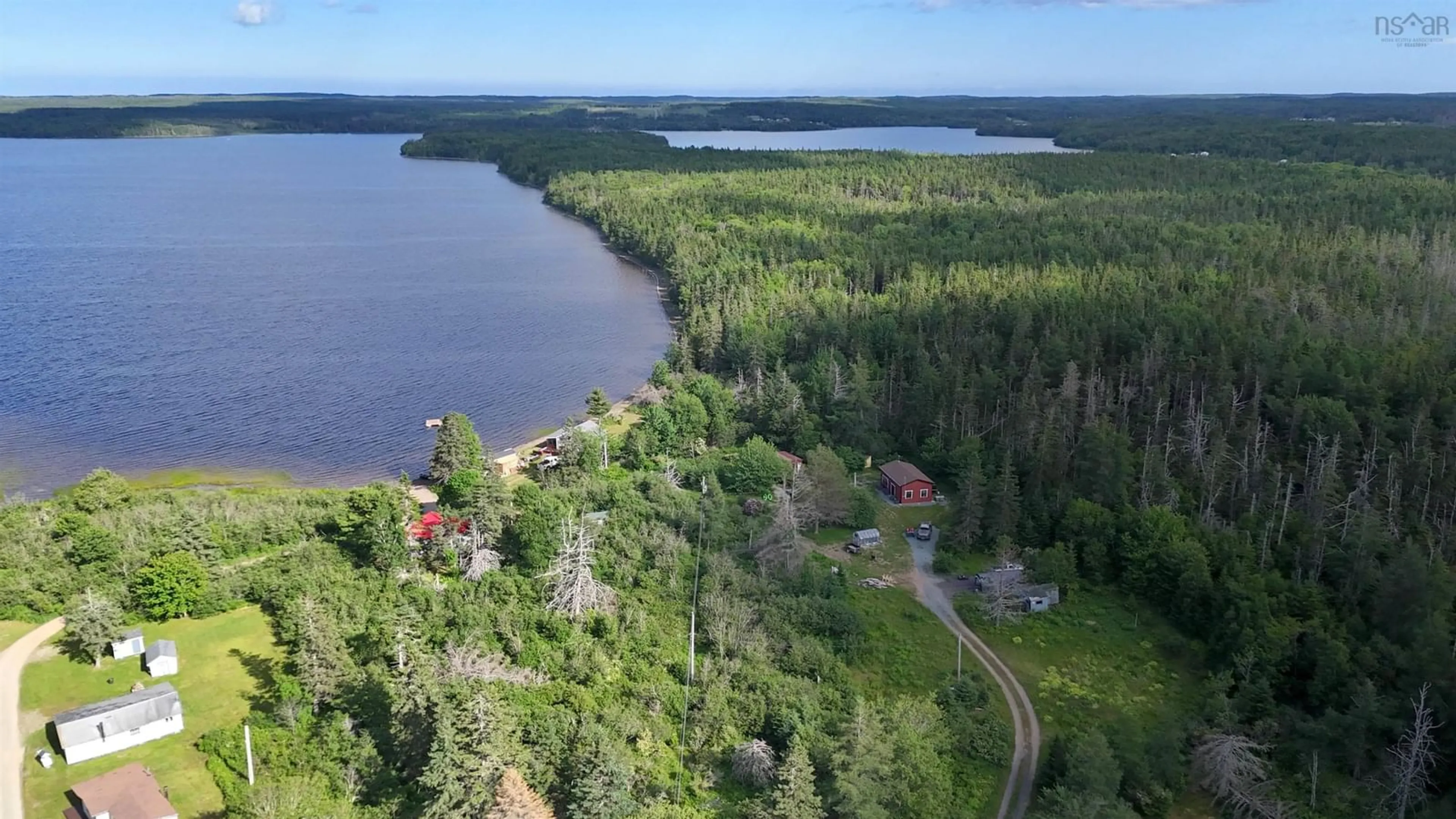 A pic from outside/outdoor area/front of a property/back of a property/a pic from drone, water/lake/river/ocean view for 82 Golden River Rd, Loch Lomond Nova Scotia B2E 1B2
