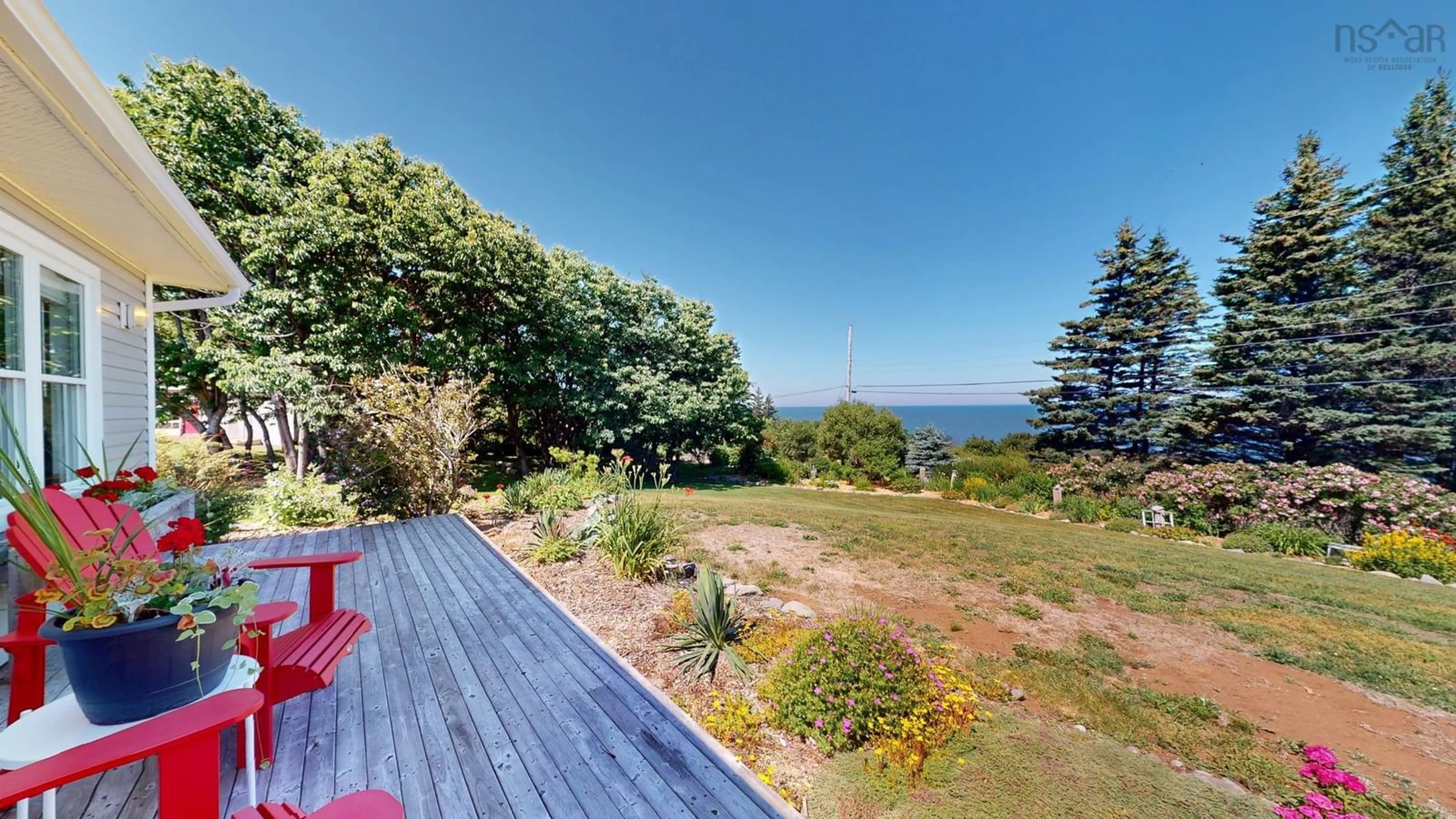 A pic from outside/outdoor area/front of a property/back of a property/a pic from drone, water/lake/river/ocean view for 162 Cottage Rd, Ogilvie Nova Scotia B0P 1E0