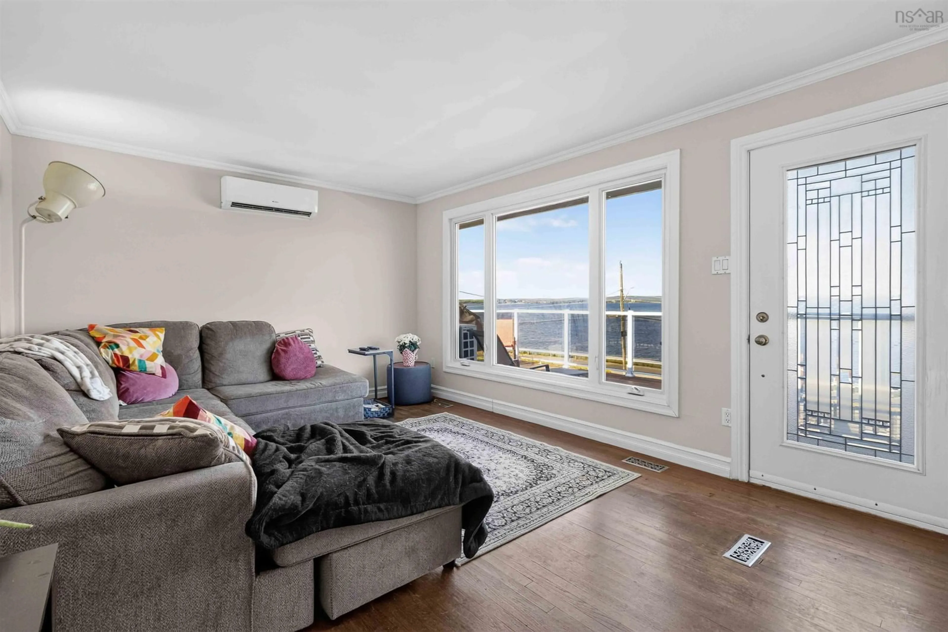 Living room with furniture, wood/laminate floor for 2325 Crowell Rd, East Lawrencetown Nova Scotia B2Z 1P3