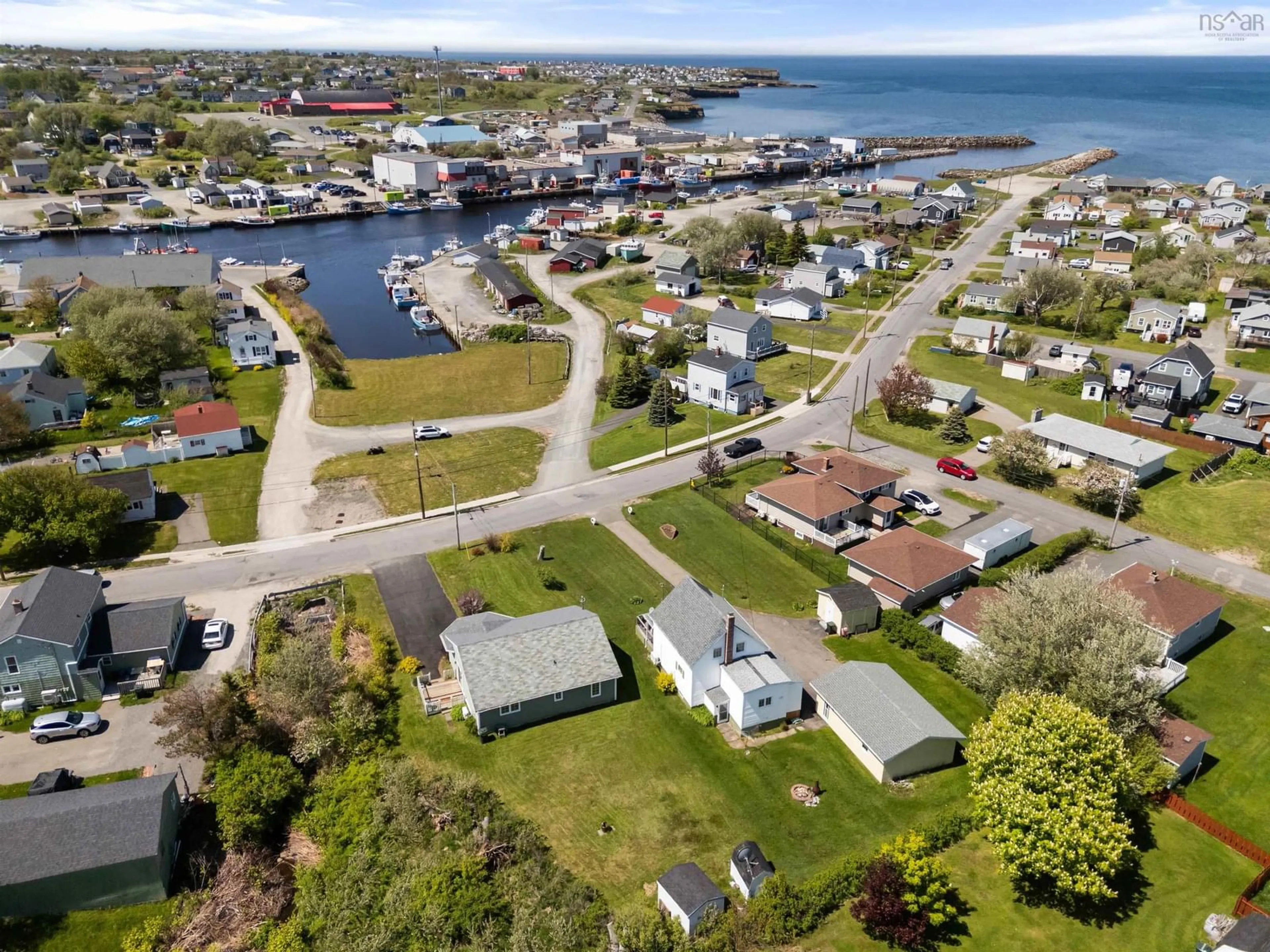 A pic from outside/outdoor area/front of a property/back of a property/a pic from drone, water/lake/river/ocean view for 34 Water St, Glace Bay Nova Scotia B1A 1R3