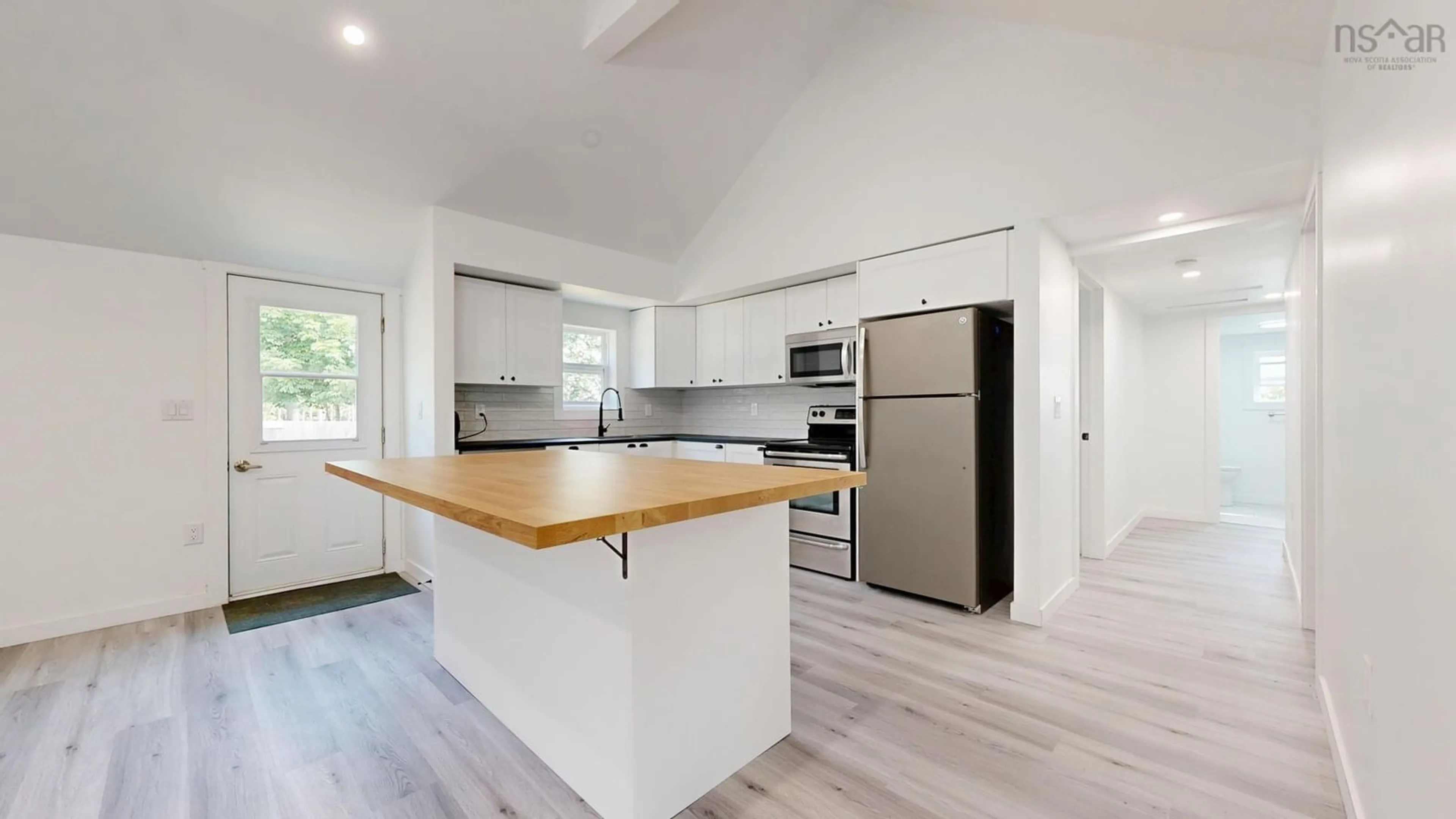 Open concept kitchen, wood/laminate floor for 30 Harden Walker Rd, Martins Point Nova Scotia B0J 2E0